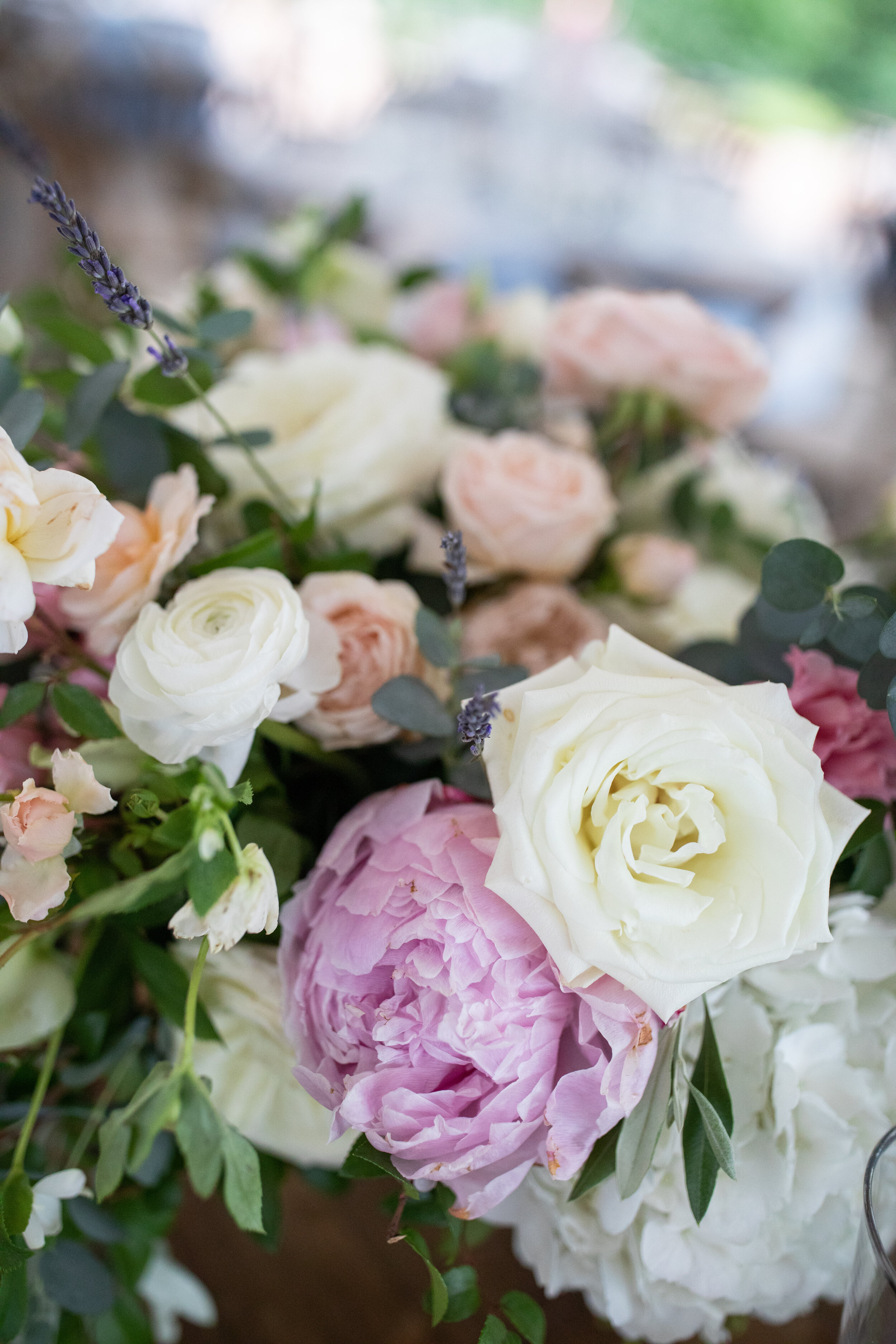 Low floral blush, ivory, and neutral centerpieces with hydrangeas, peonies, garden roses, ranunculus, ferns, and olives branches. Belle Meade Plantation wedding and event florist.