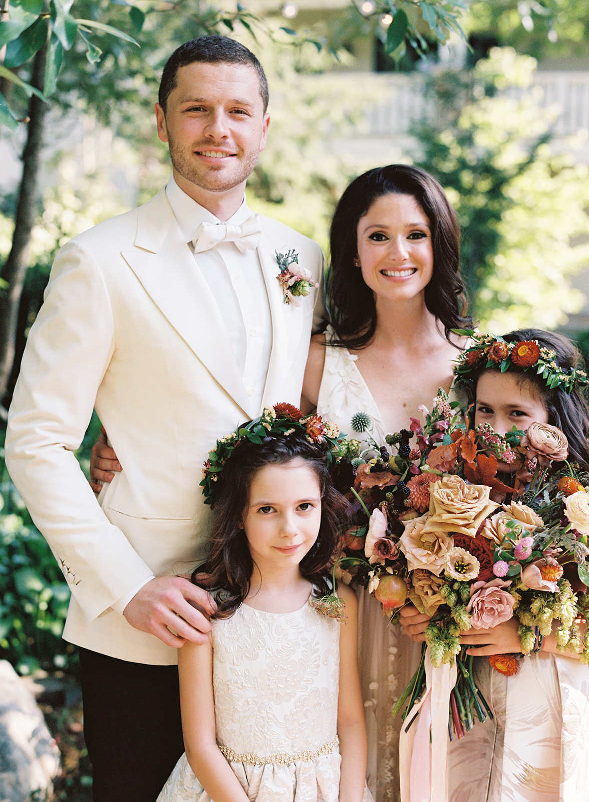 Flower girls with dainty wildflower crowns and rose petals. Nashville Wedding Florist.