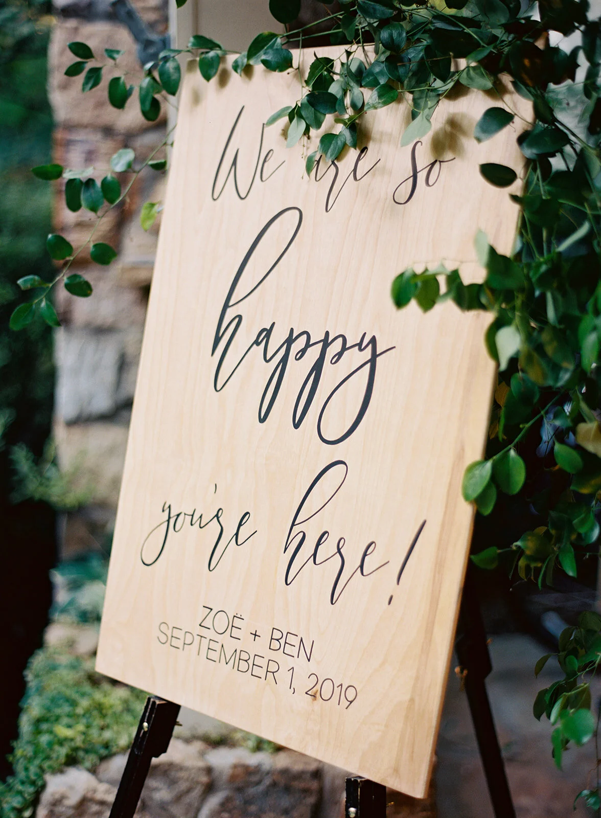 Light greenery garland for the welcome sign. RT Lodge wedding florist.