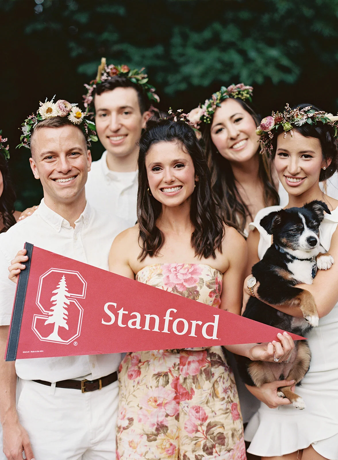 White linen welcome dinner with flower crown for every guest. Wildflower crown booth by Rosemary & Finch, RT Lodge and Nashville luxury wedding florist.