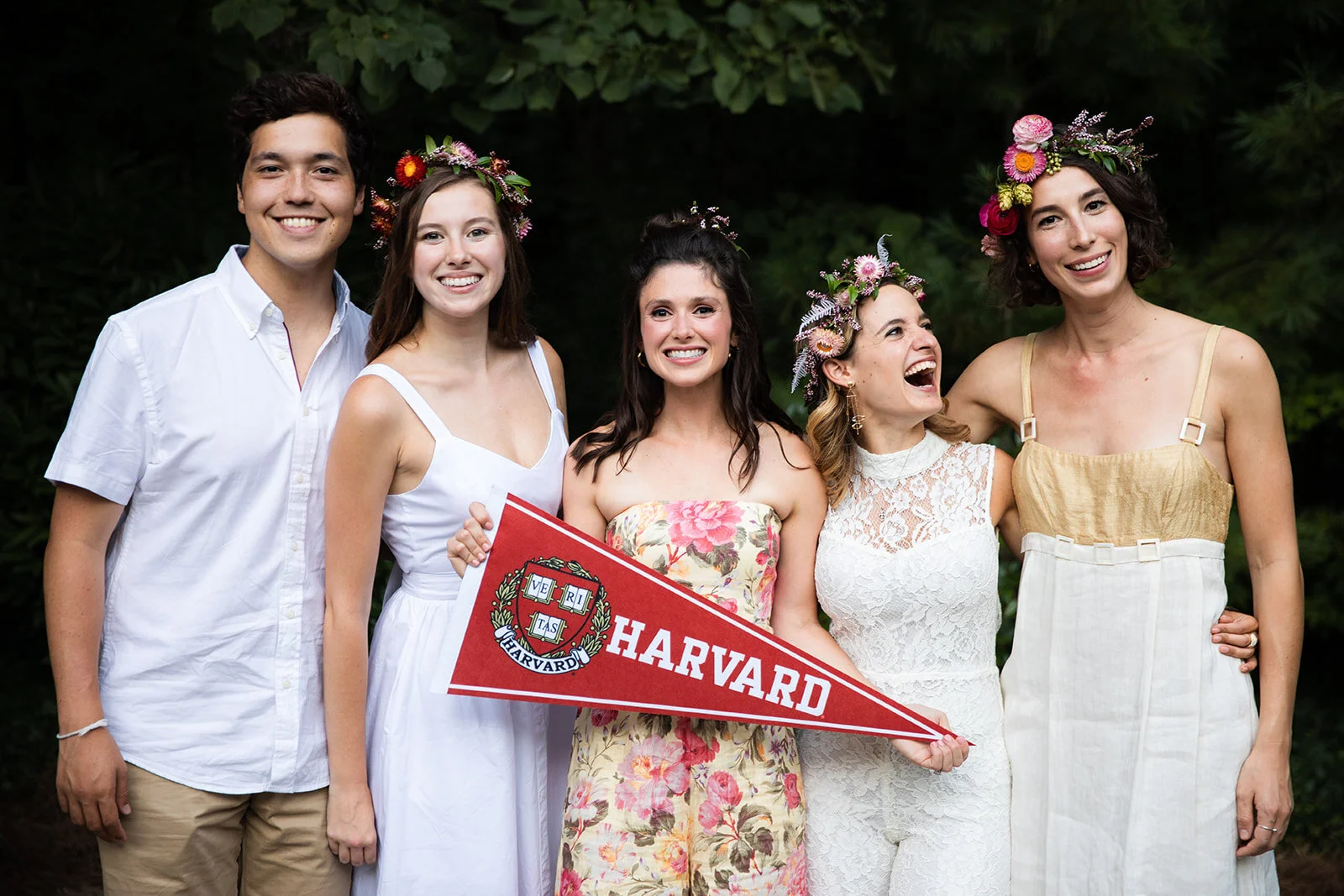 White linen welcome dinner with flower crown for every guest. Wildflower crown booth by Rosemary & Finch, RT Lodge and Nashville luxury wedding florist.