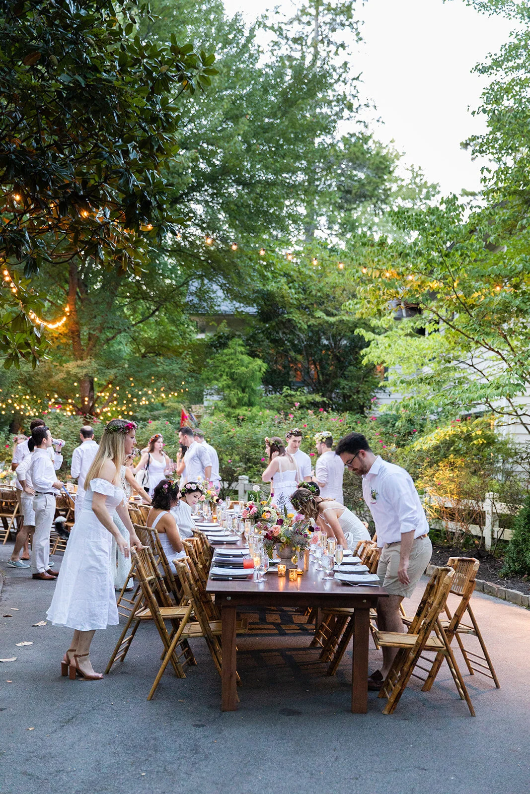 Garden urn wildflower centerpiece with deep red garden roses, dusty pink ranunculus, hops, berries, maroon snapdragon, thistles, golden yellow zinnias, and natural greenery. RT Lodge and Nashville luxury wedding floral designer.