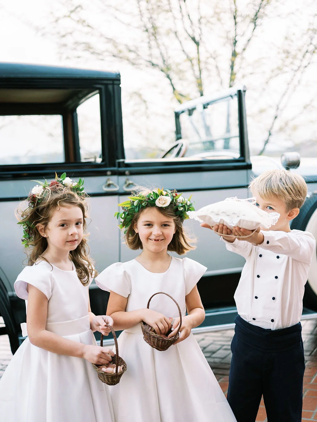 Dainty flower girl crowns with muted fall color palette and dusty blush rose petals. Vintage car for the bride. Nashville wedding floral designer, Mary Love Richardson of Rosemary & Finch.