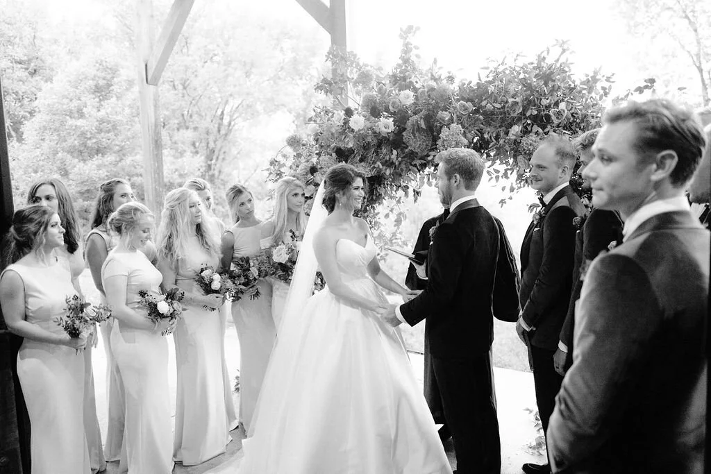 Wild, organic, round floral arch with autumnal color palette and fruit accents. Nashville wedding floral design at Trinity View Farm.
