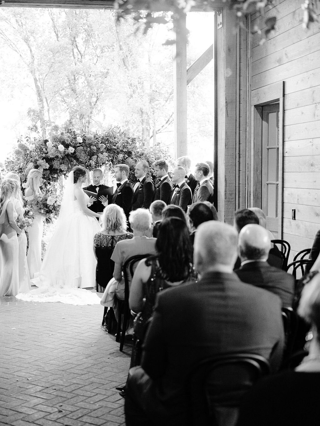 Wild, organic, round floral arch with autumnal color palette and fruit accents. Nashville wedding floral design at Trinity View Farm.