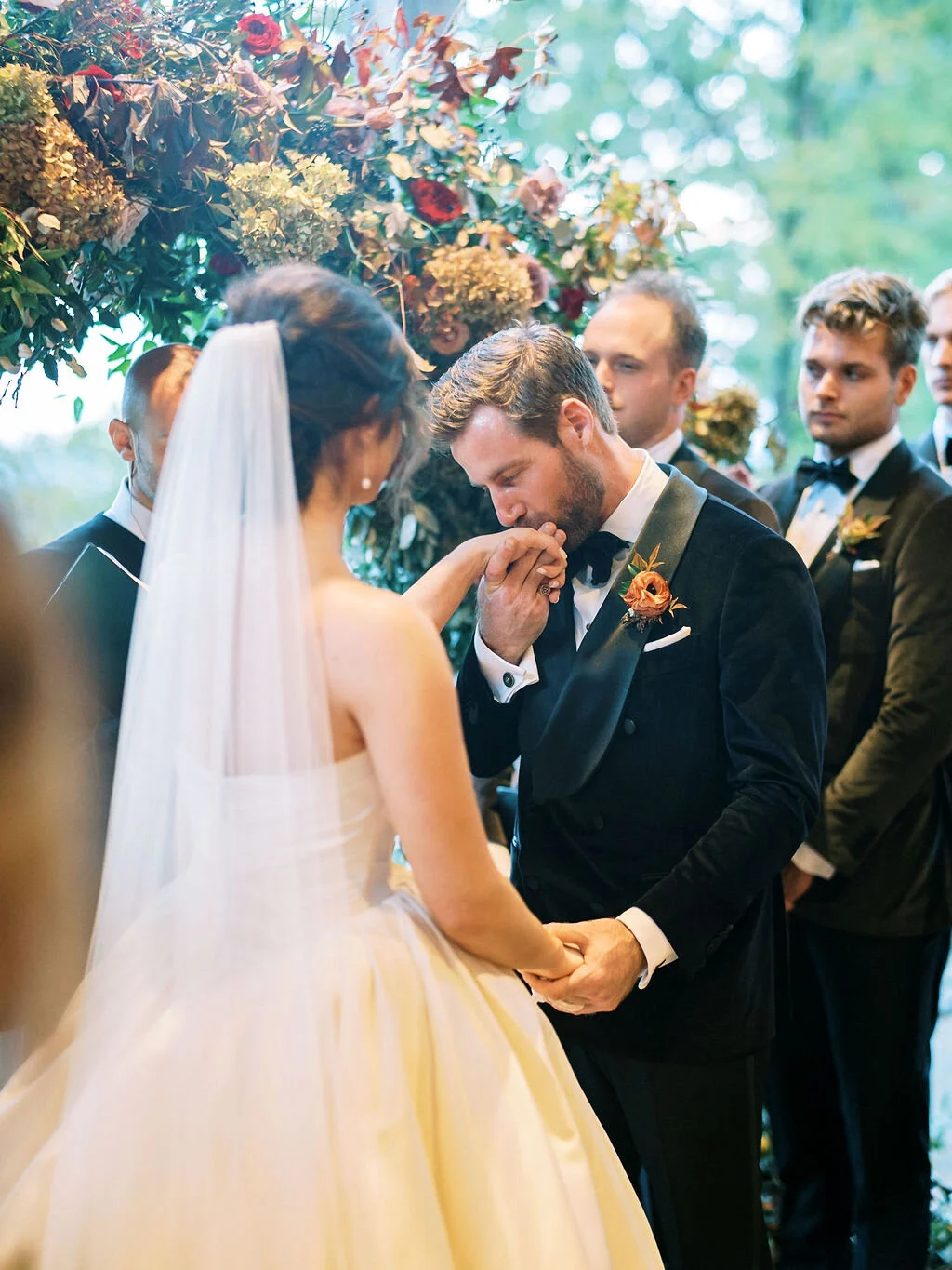 Wild, organic, round floral arch with autumnal color palette and fruit accents. Nashville wedding floral design at Trinity View Farm.