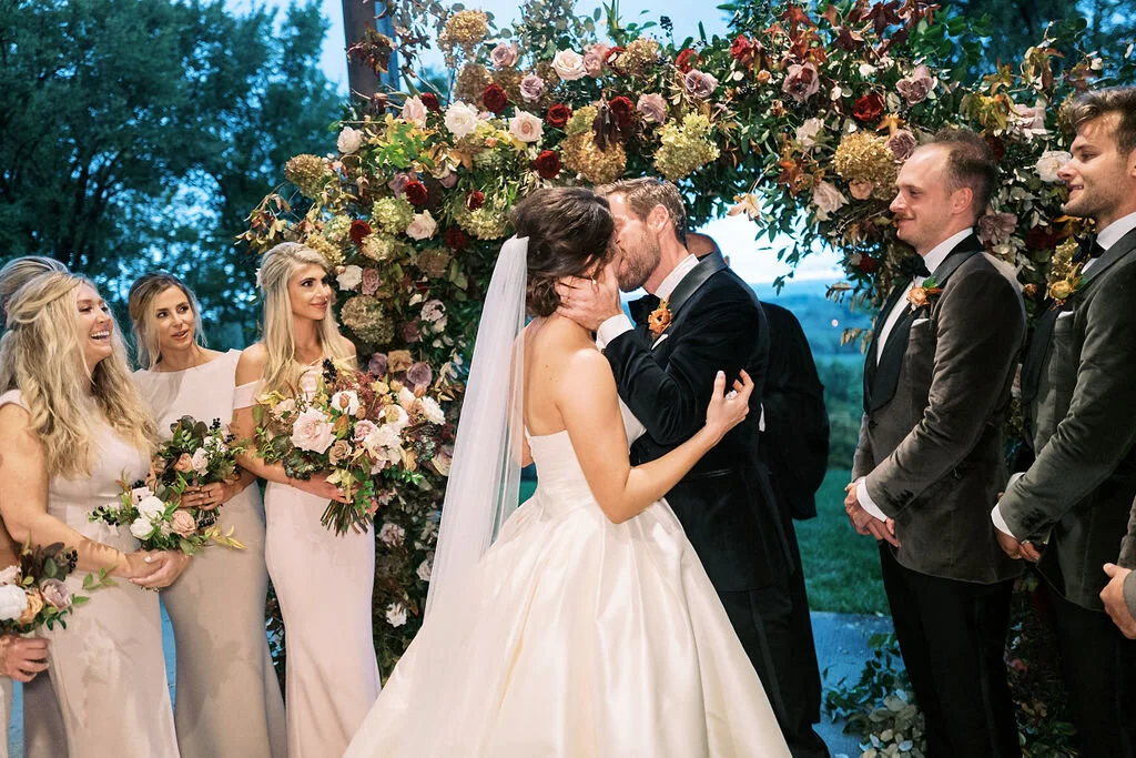 Wild, organic, round floral arch with autumnal color palette and fruit accents. Nashville wedding floral design at Trinity View Farm.