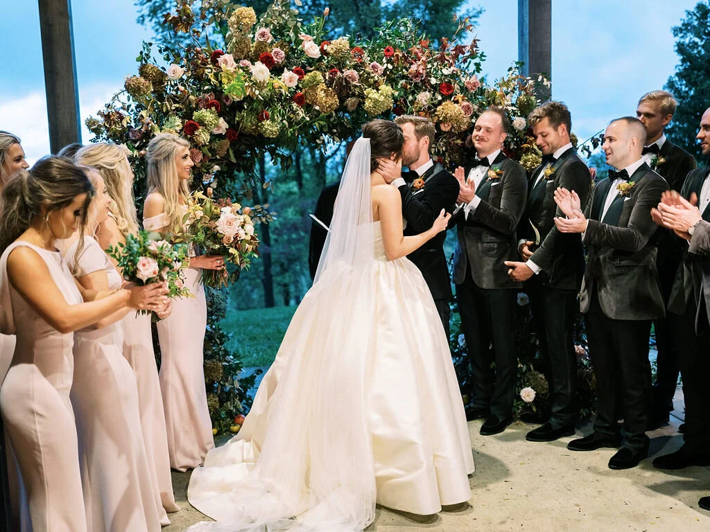 Wild, organic, round floral arch with autumnal color palette and fruit accents. Nashville wedding floral design at Trinity View Farm.