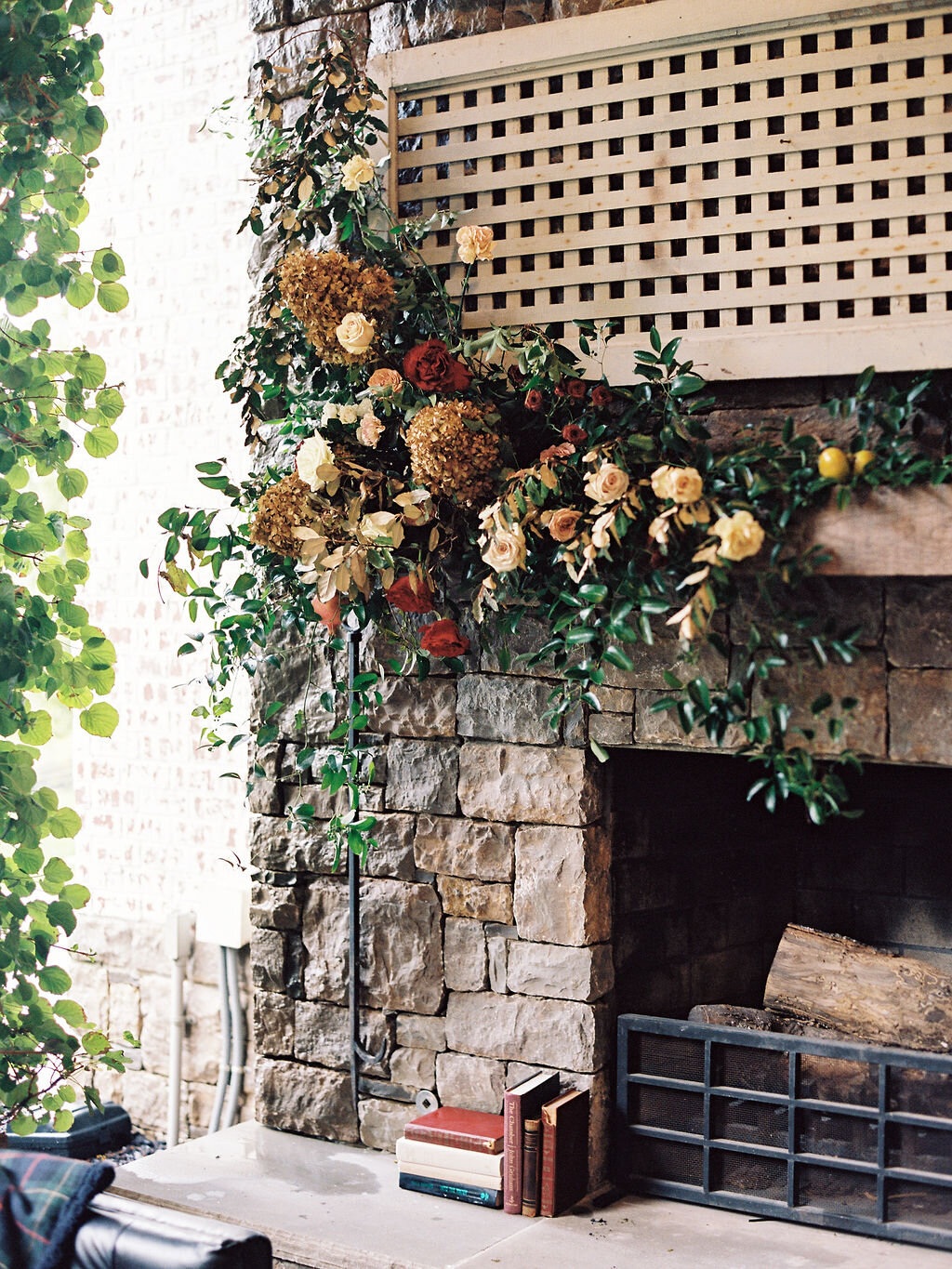 Lush, asymmetrical floral installation for the mantle. Wedding and event floral design at Trinity View Farm by Rosemary & Finch.