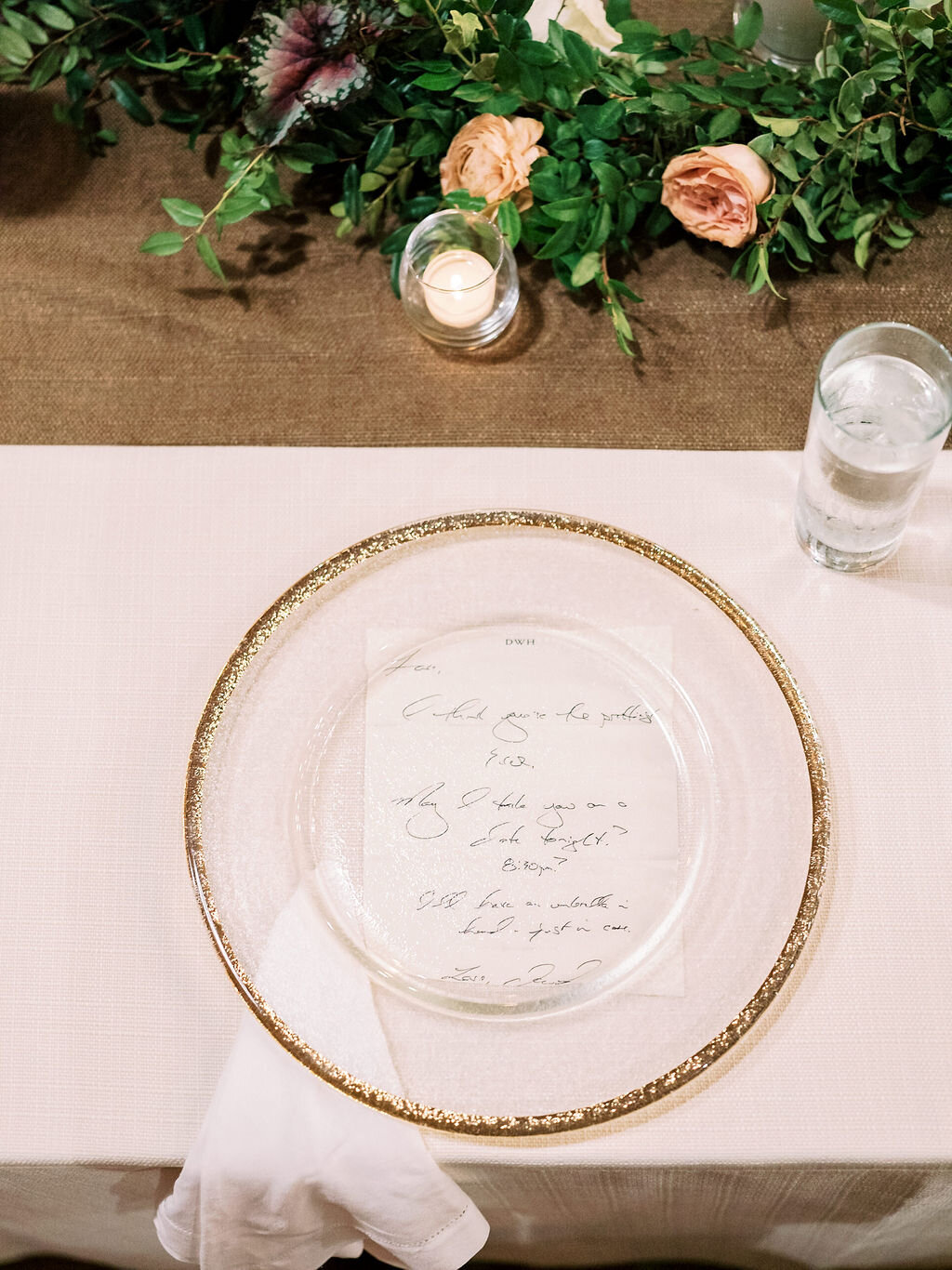 Low garland runner for the head table with floral and fruit accents in a muted fall color palette. Nashville wedding and event floral design at Trinity View Farm.