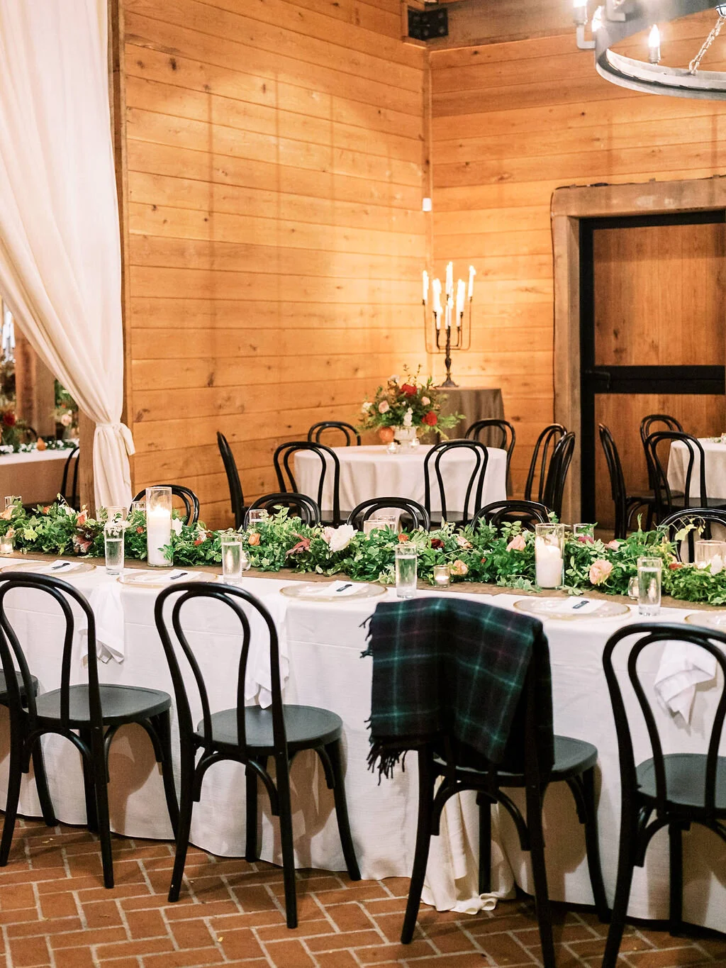 Low garland runner for the head table with floral and fruit accents in a muted fall color palette. Nashville wedding and event floral design at Trinity View Farm.