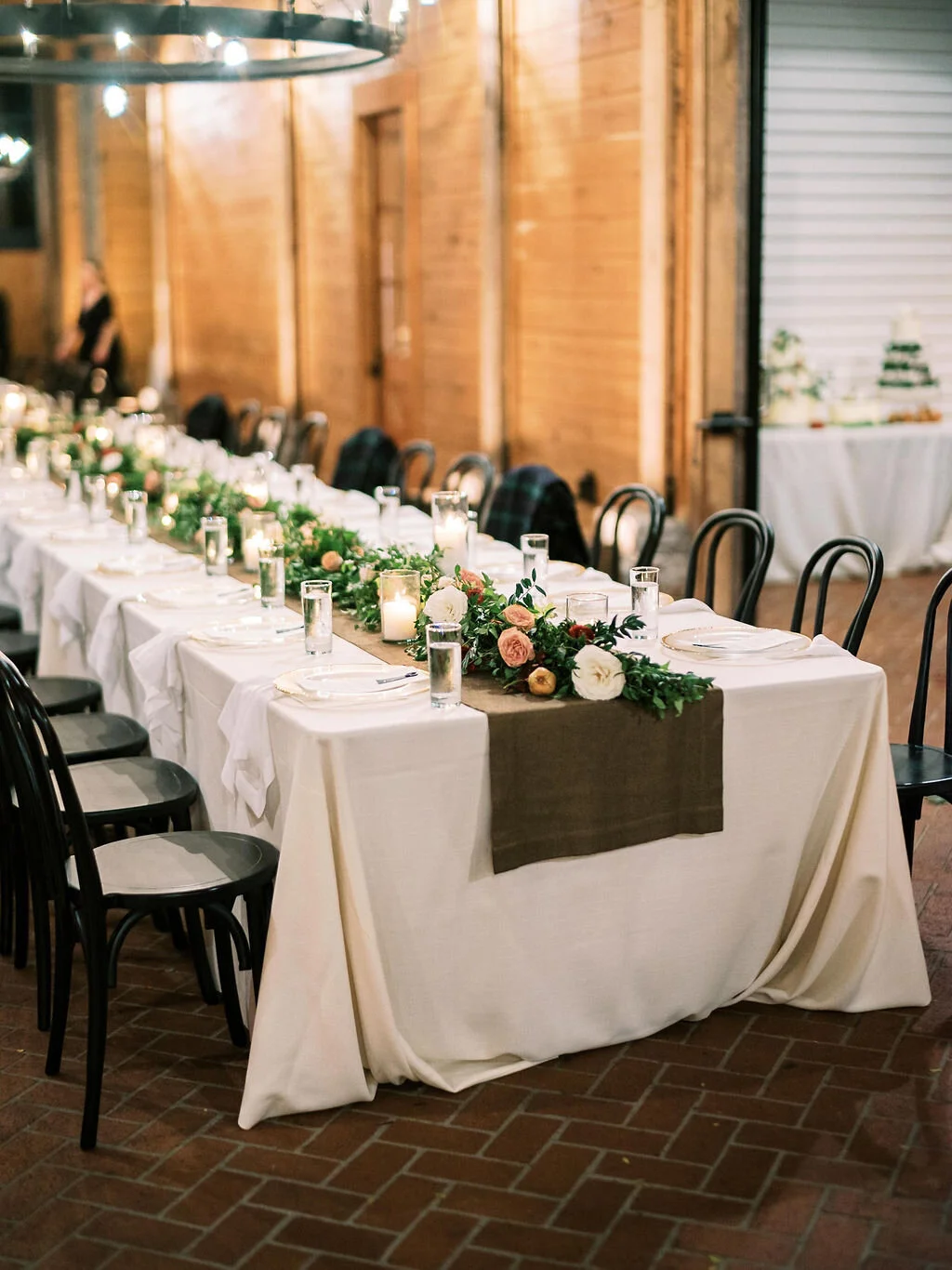 Low garland runner for the head table with floral and fruit accents in a muted fall color palette. Nashville wedding and event floral design at Trinity View Farm.