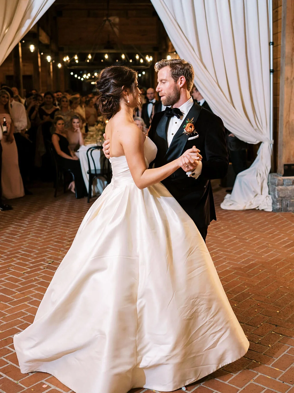 Unique fall boutonnieres with ranunculus, berries, autumn textures, and fall foliage. Nashville wedding florist at Trinity View Farm.