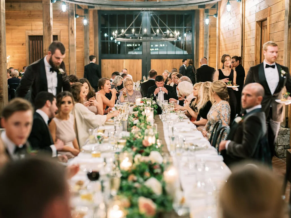 Low garland runner for the head table with floral and fruit accents in a muted fall color palette. Nashville wedding and event floral design at Trinity View Farm.
