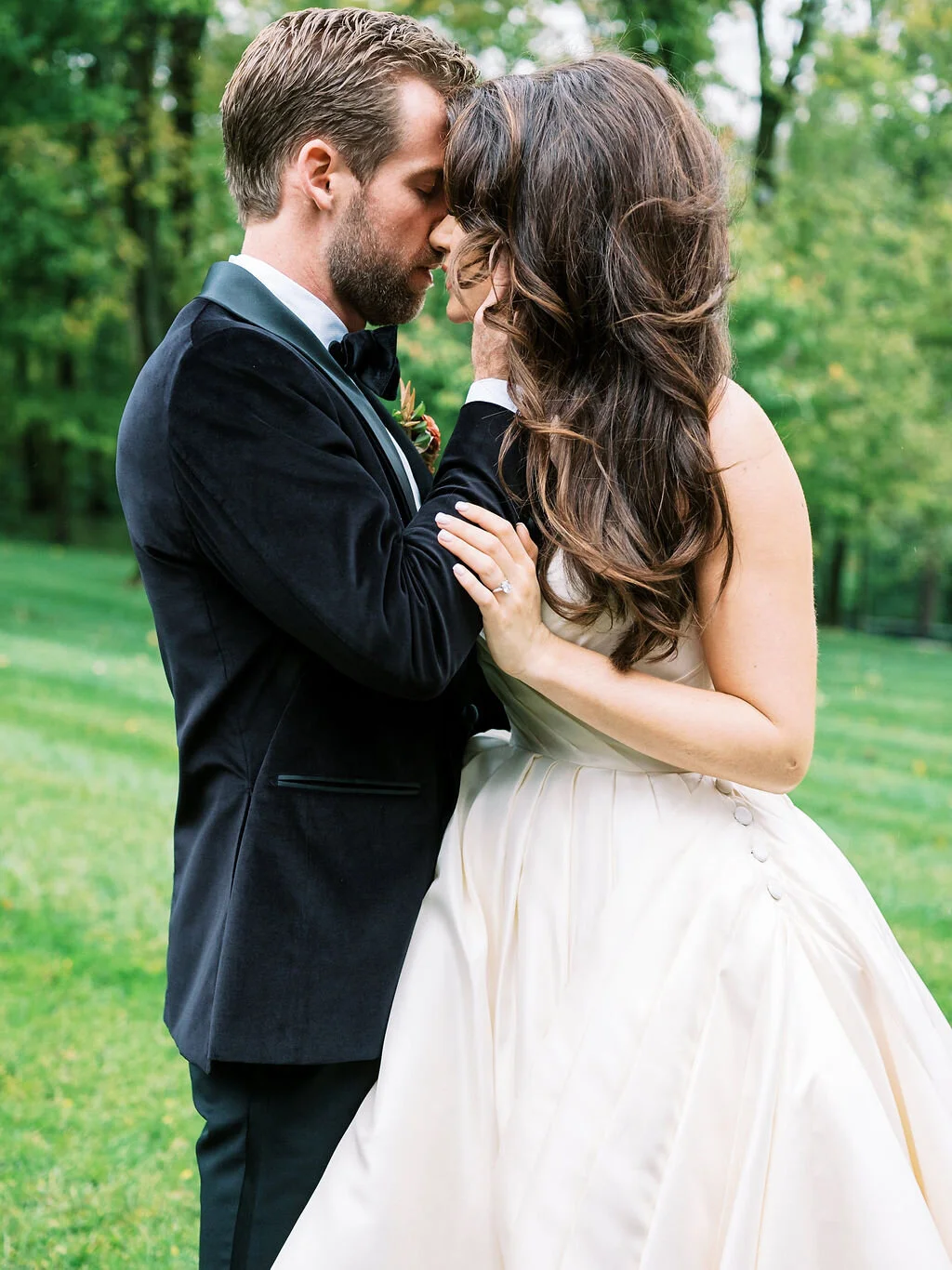 Unique fall boutonnieres with ranunculus, berries, autumn textures, and fall foliage. Nashville wedding florist at Trinity View Farm.