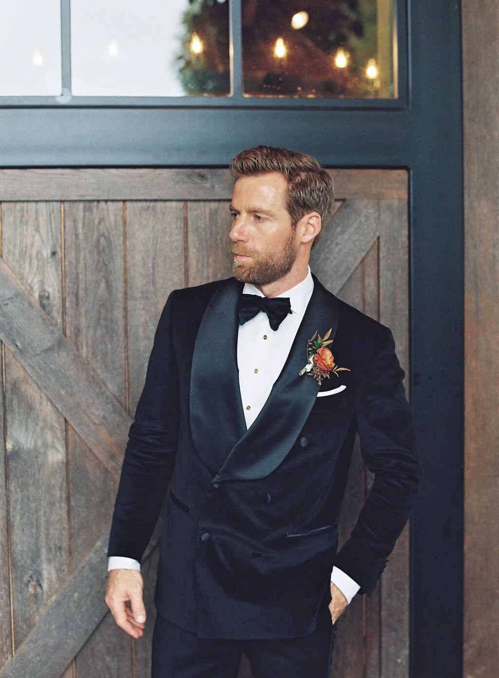 Unique fall boutonnieres with ranunculus, berries, autumn textures, and fall foliage. Nashville wedding florist at Trinity View Farm.