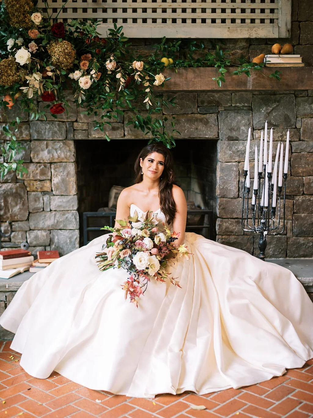 Lush, wild, untamed fall bridal bouquet with a muted autumnal color palette, composed of ligustrum berries, dusty pink ranunculus, tulips, garden roses, fall leaves, begonia leaves, and muted textures. Nashville wedding and corporate event floral de…