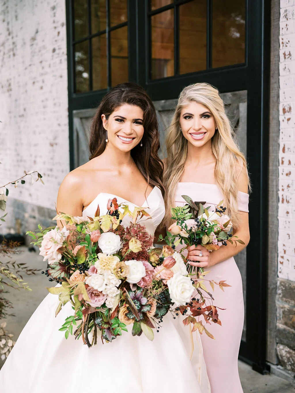 Blush bridesmaid dresses with fall floral bouquets of garden roses, ranunculus, berries, and fall leaves and greenery. Nashville wedding florist at Trinity View Farm.
