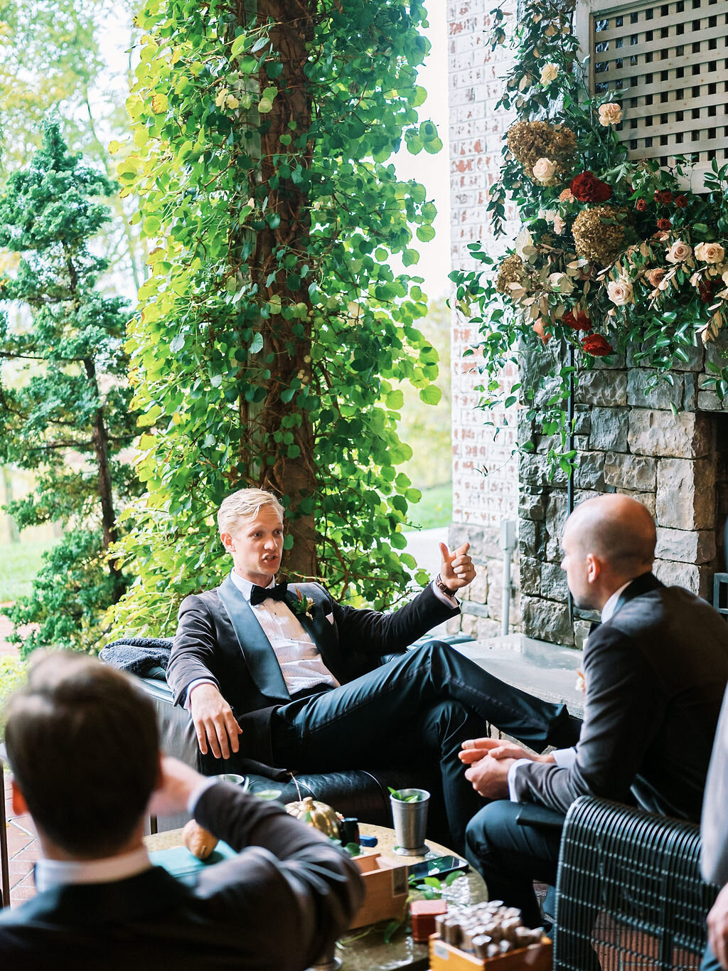 Unique fall boutonnieres with ranunculus, berries, autumn textures, and fall foliage. Nashville wedding florist at Trinity View Farm.