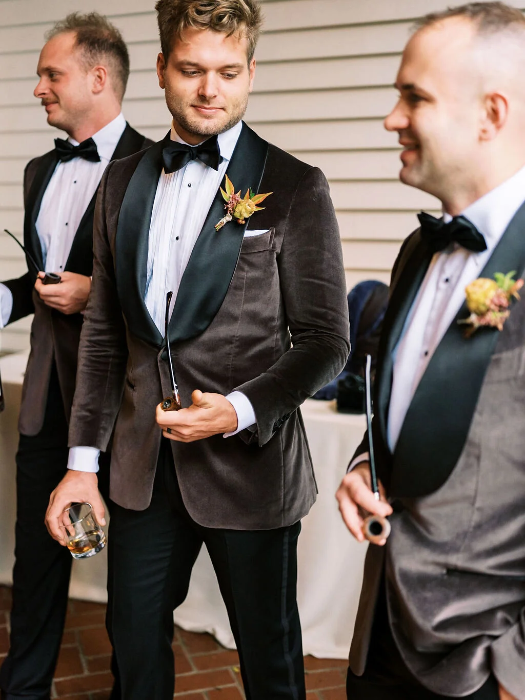 Unique fall boutonnieres with ranunculus, berries, autumn textures, and fall foliage. Nashville wedding florist at Trinity View Farm.