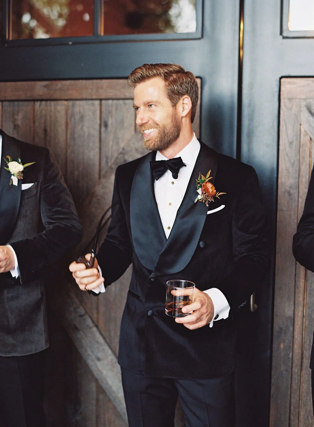 Unique fall boutonnieres with ranunculus, berries, autumn textures, and fall foliage. Nashville wedding florist at Trinity View Farm.