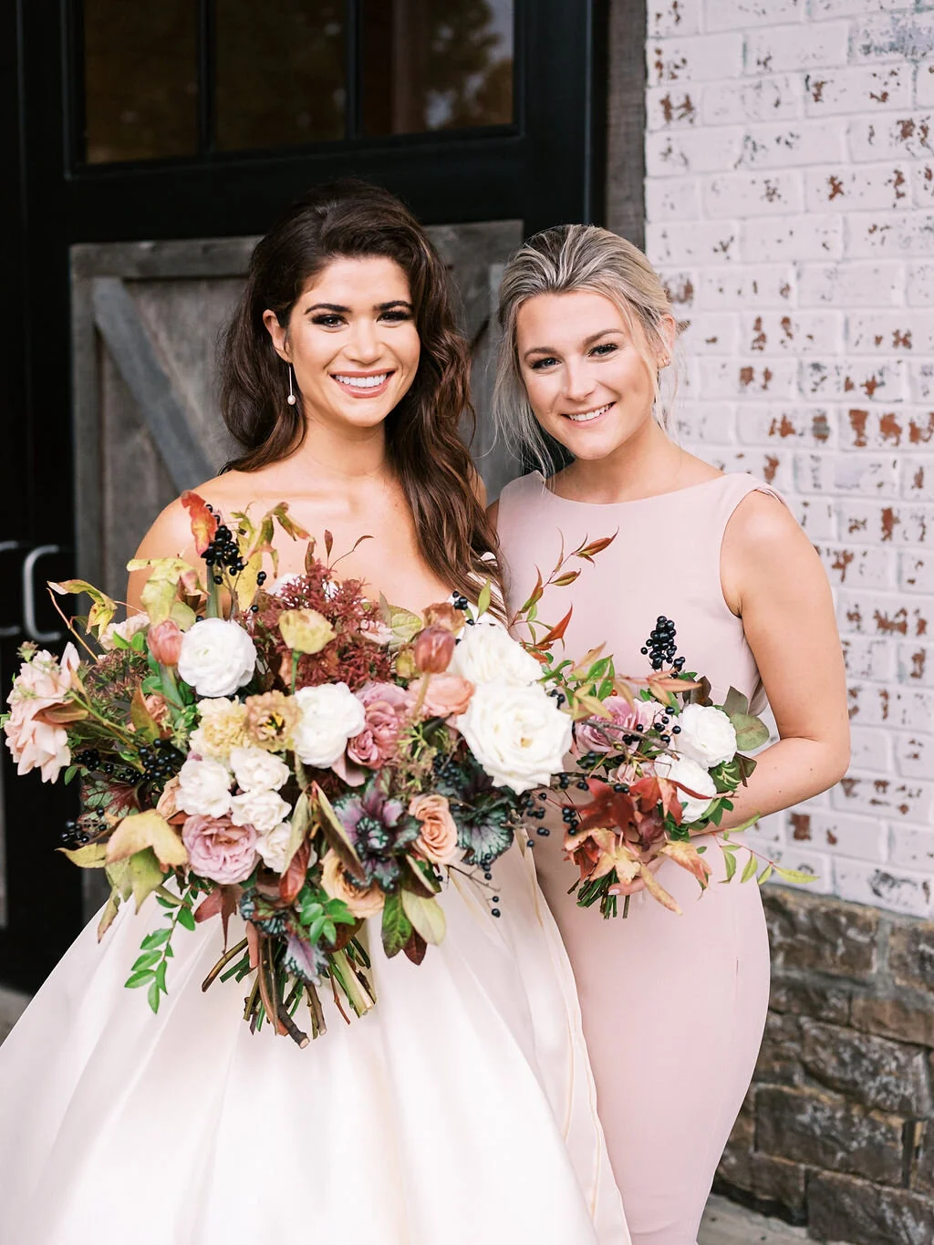 Blush bridesmaid dresses with fall floral bouquets of garden roses, ranunculus, berries, and fall leaves and greenery. Nashville wedding florist at Trinity View Farm.