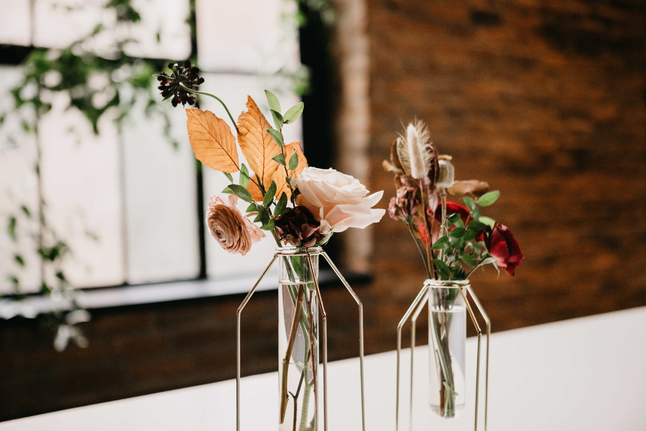 Modern, geometric bud vase with fall florals and dried elements. Nashville wedding florist, Rosemary & Finch, at Clementine.