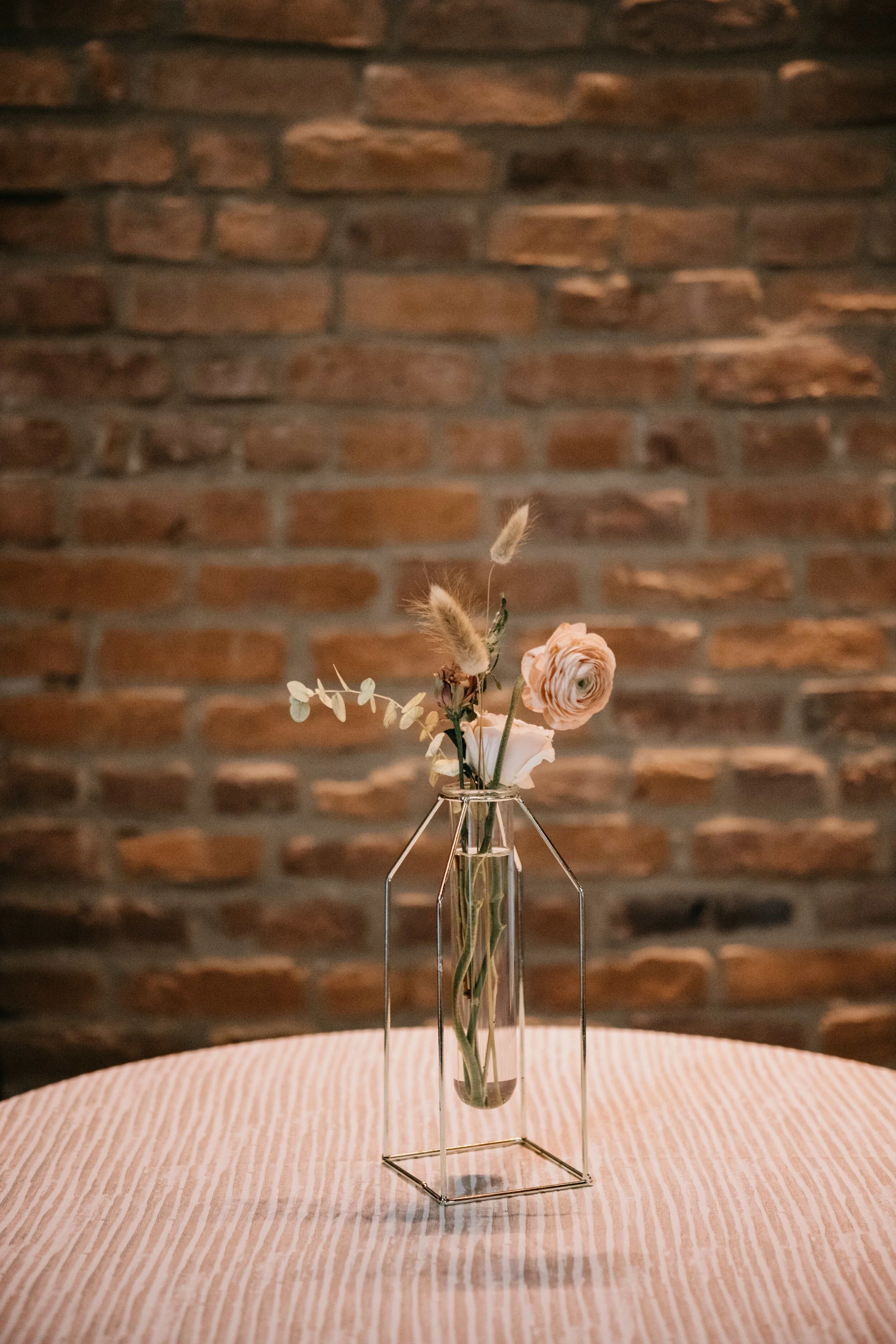 Modern, geometric bud vase with fall florals and dried elements. Nashville wedding florist, Rosemary & Finch, at Clementine.