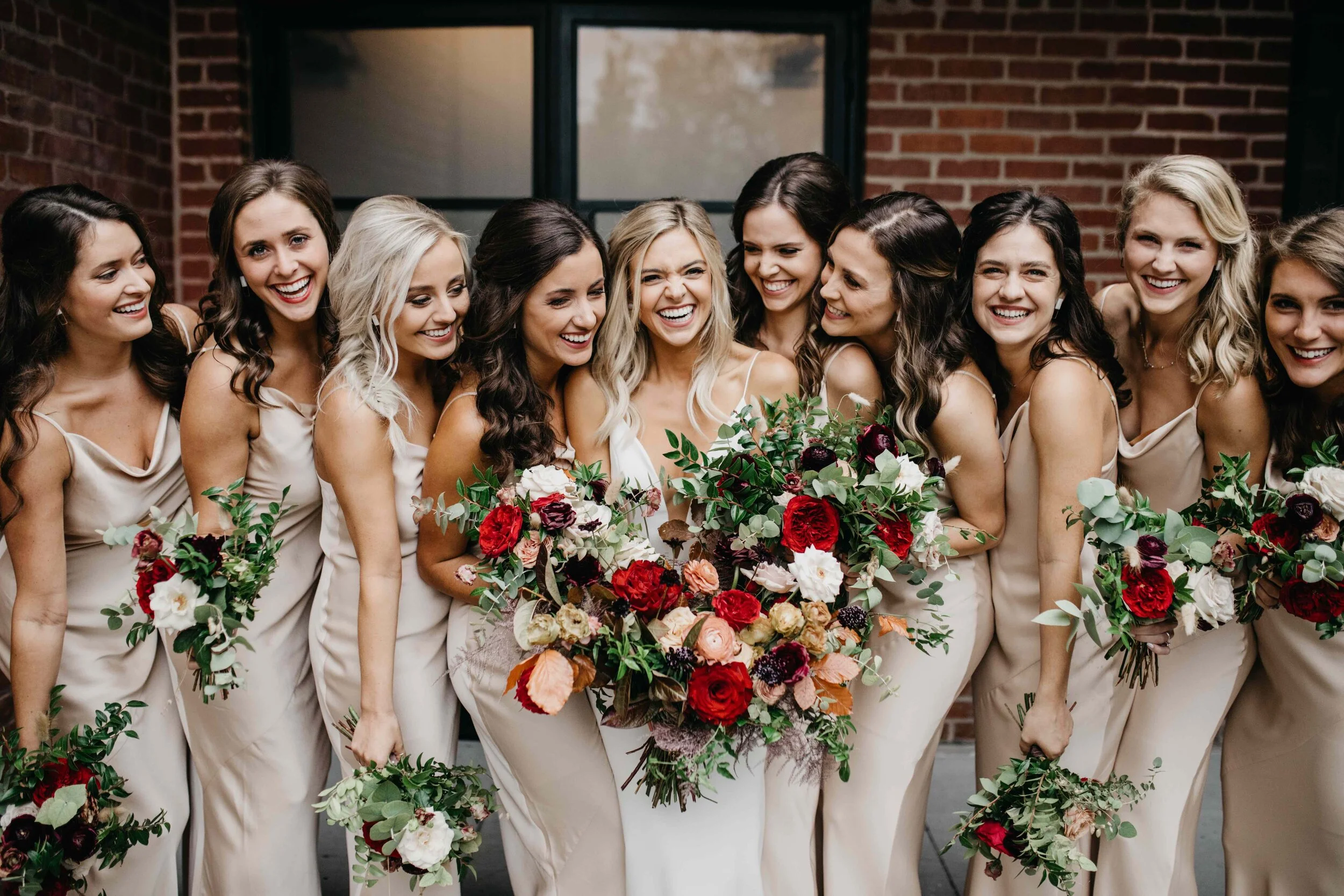 Champagne bridesmaid dresses with vibrant, deep color palette for the bouquets with burgundy garden roses, dusty rose and eggplant ranunculus, copper fall foliage, and airy greenery. Nashville wedding florist, Rosemary & Finch Floral Design.