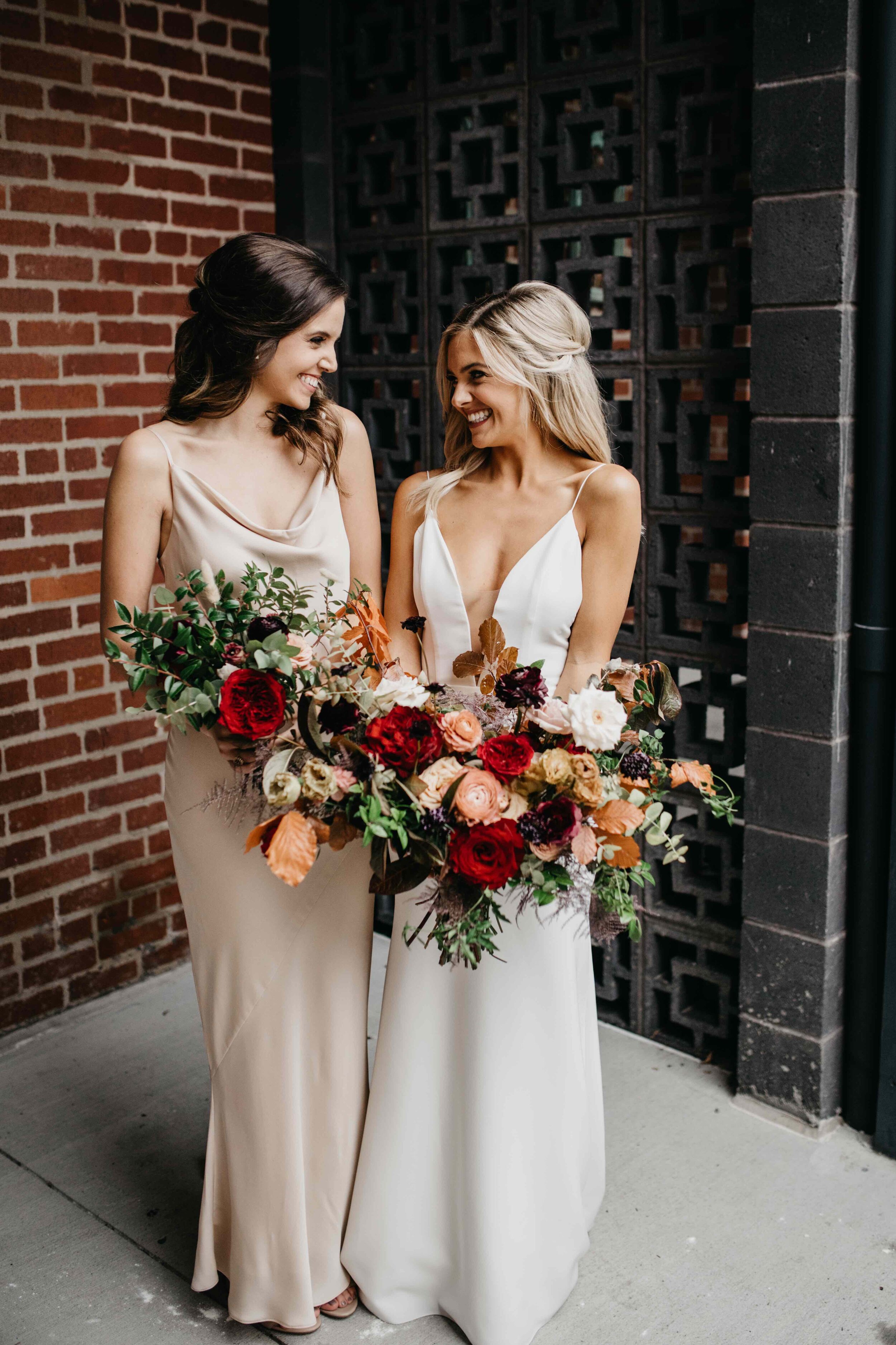 Champagne bridesmaid dresses with vibrant, deep color palette for the bouquets with burgundy garden roses, dusty rose and eggplant ranunculus, copper fall foliage, and airy greenery. Nashville wedding florist, Rosemary & Finch Floral Design.