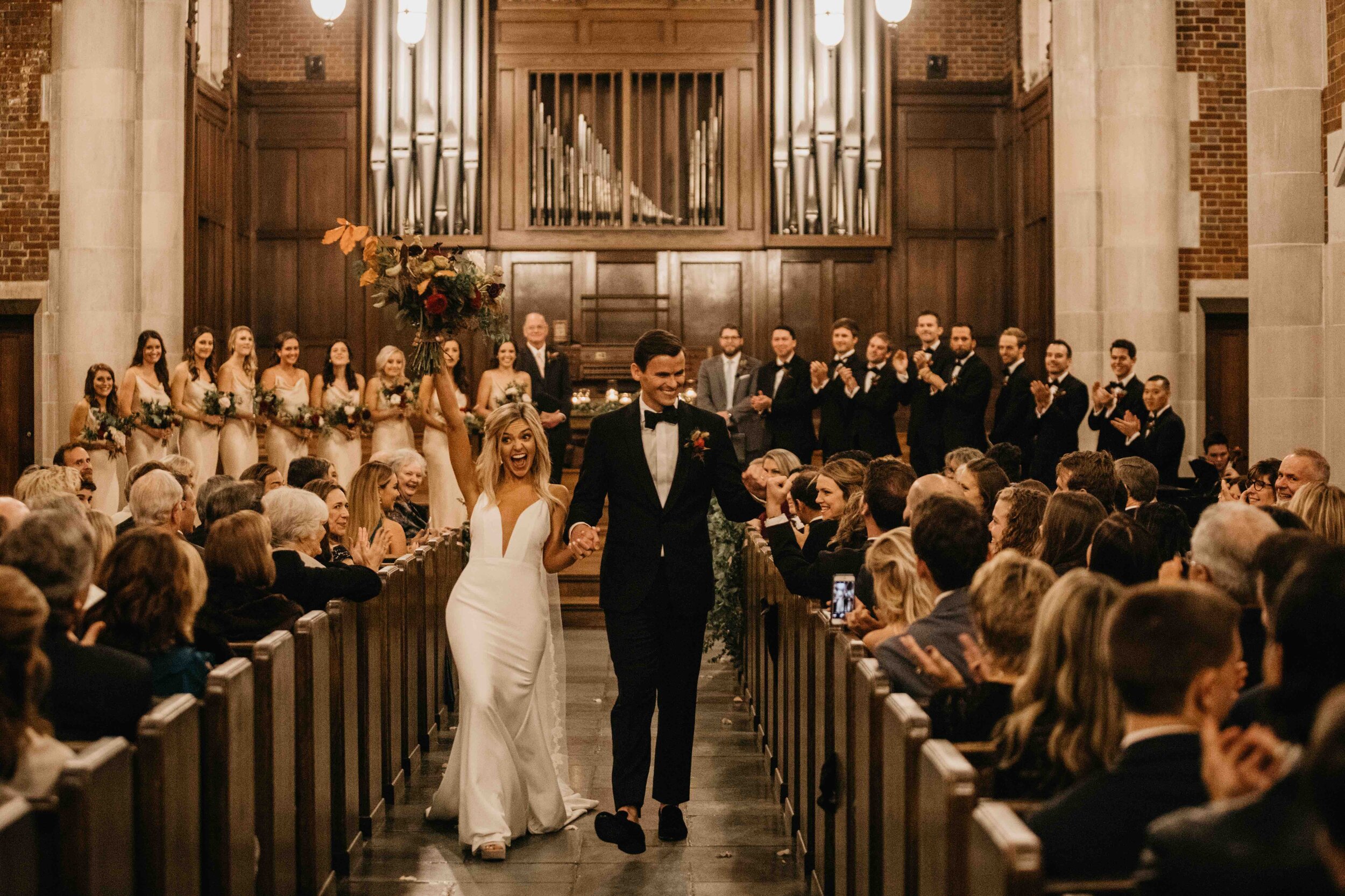 October wedding ceremony in the Wightman Chapel at Scarritt-Bennett. Natural, asymmetrical bride’s bouquet with fall flowers and lush greenery. Nashville luxury wedding florist.