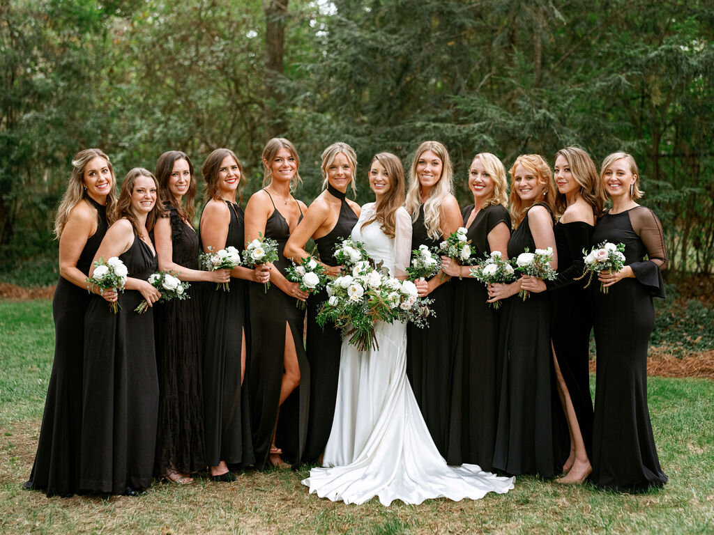 Elegant bridal party in all black with white florals and organic greenery. Belle Meade garden wedding with Nashville florist, Rosemary & Finch.
