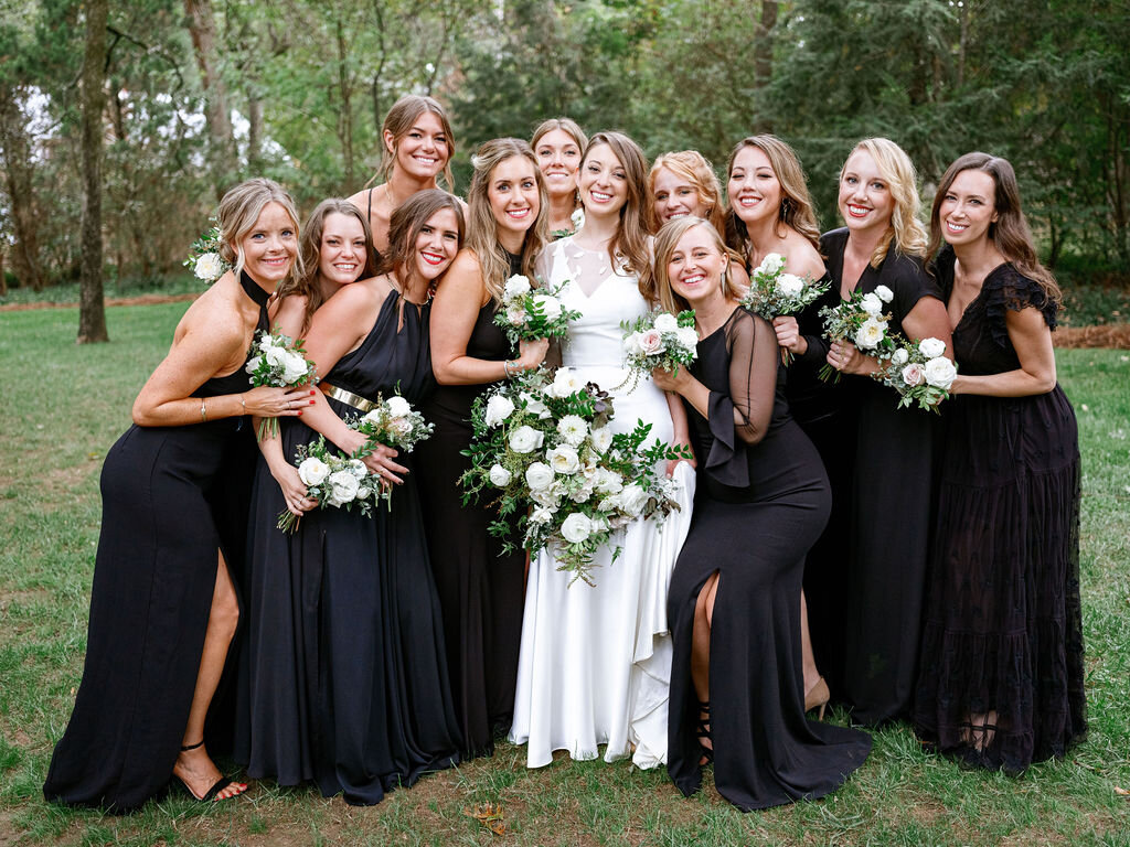 Black bridesmaid dresses with all white and green bouquets. Nashville Wedding Florist.