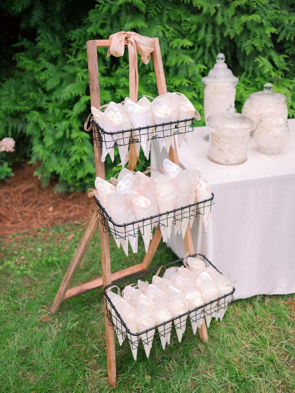 White petals tossed at the ceremony exit of a Belle Meade garden wedding.