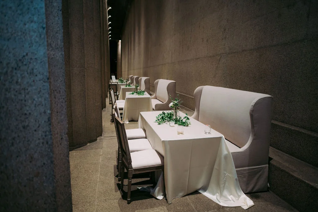 Garden inspired floral centerpieces with modern gold bud vases for a wedding reception at the Parthenon in Nashville.