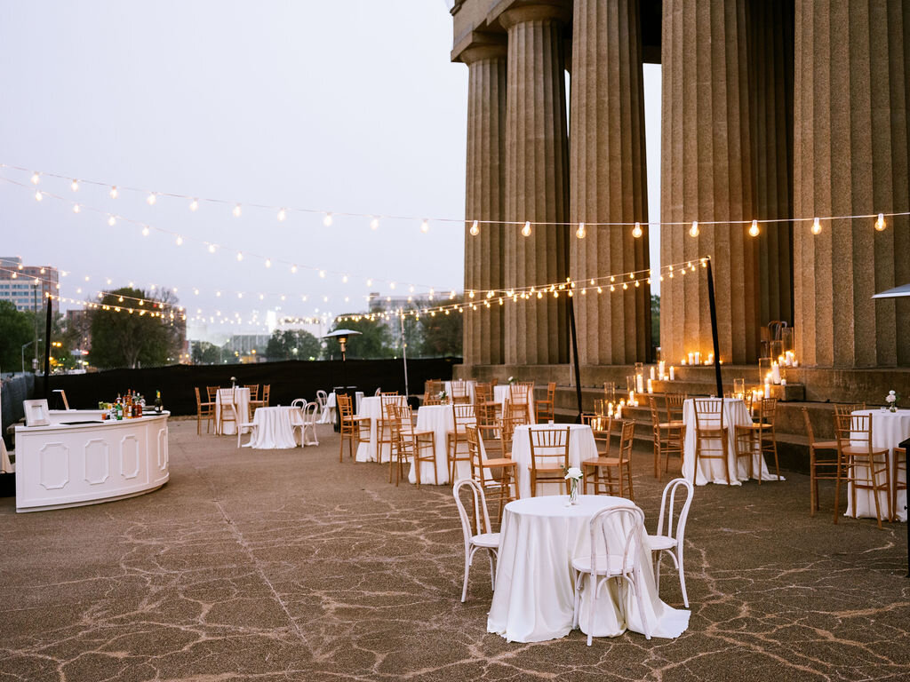 Cocktail hour in front of the Parthenon. Nashville wedding flowers.