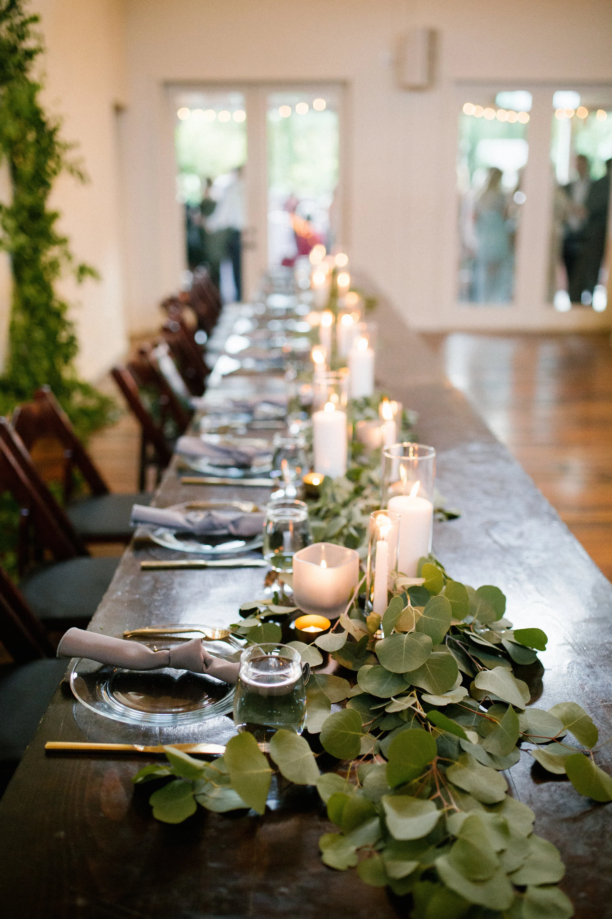 Light eucalyptus table garlands at the Cordelle. Nashville wedding flowers.