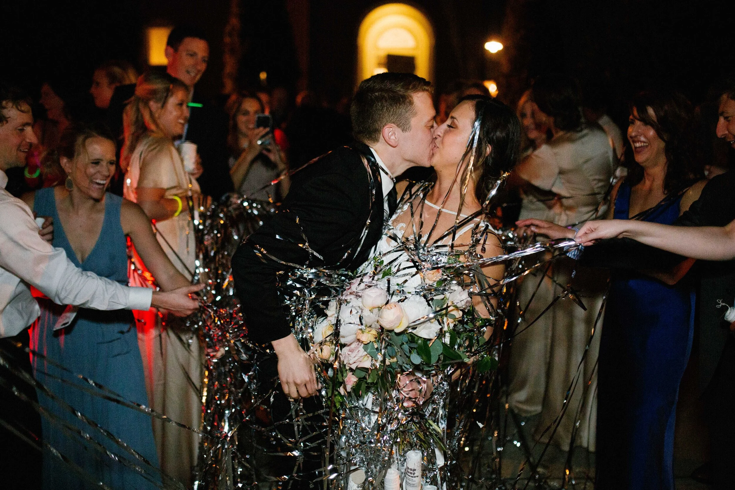 Bridal bouquet with peach ranunculus, cream peonies, blush and golden yellow garden roses, and natural, untamed greenery. June wedding at the Cordelle. Nashville Wedding Florist.