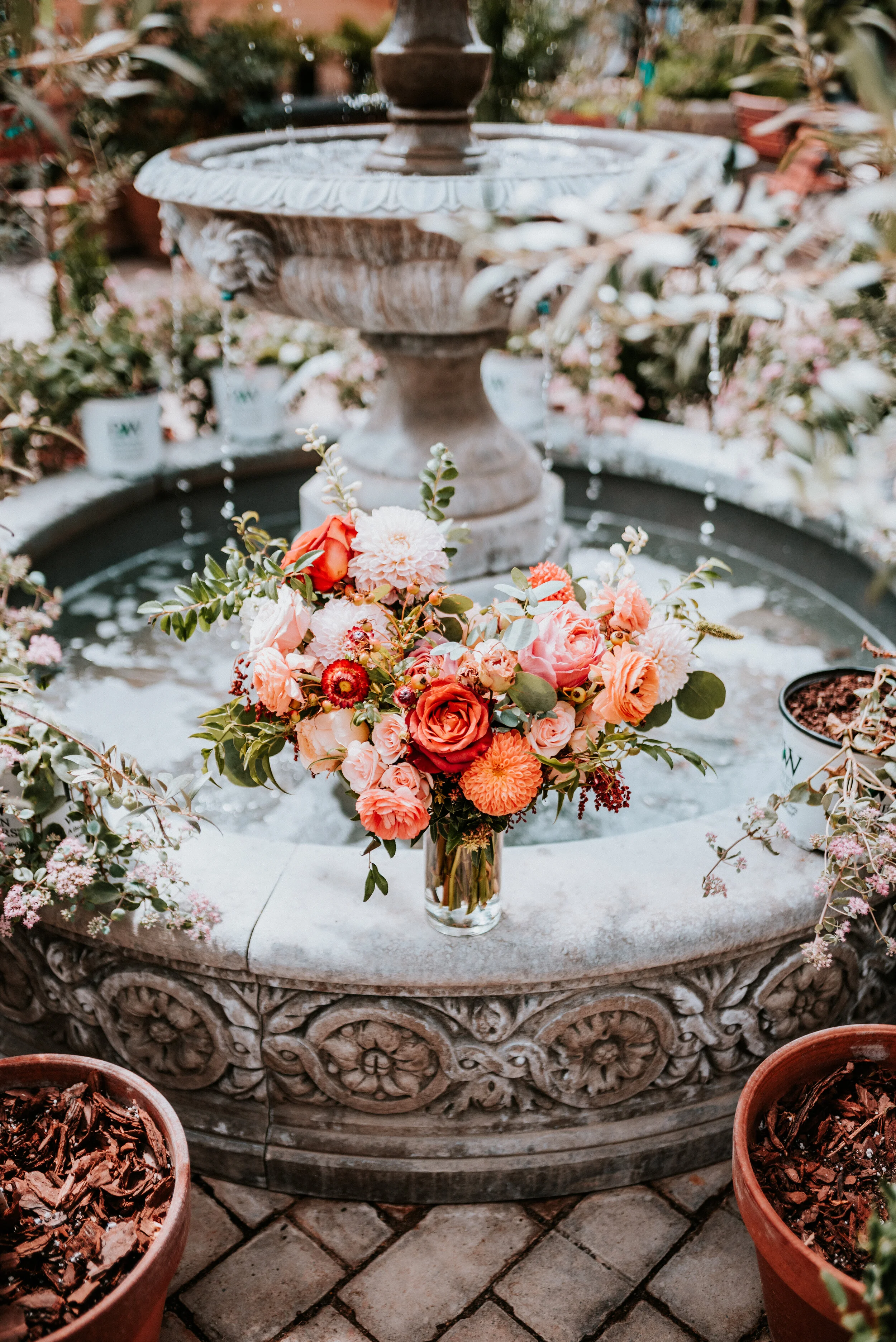 October wedding at Long Hollow Gardens with lush, asymmetrical flower arrangements in a rusty orange and soft peach color palette. Nashville wedding floral design.