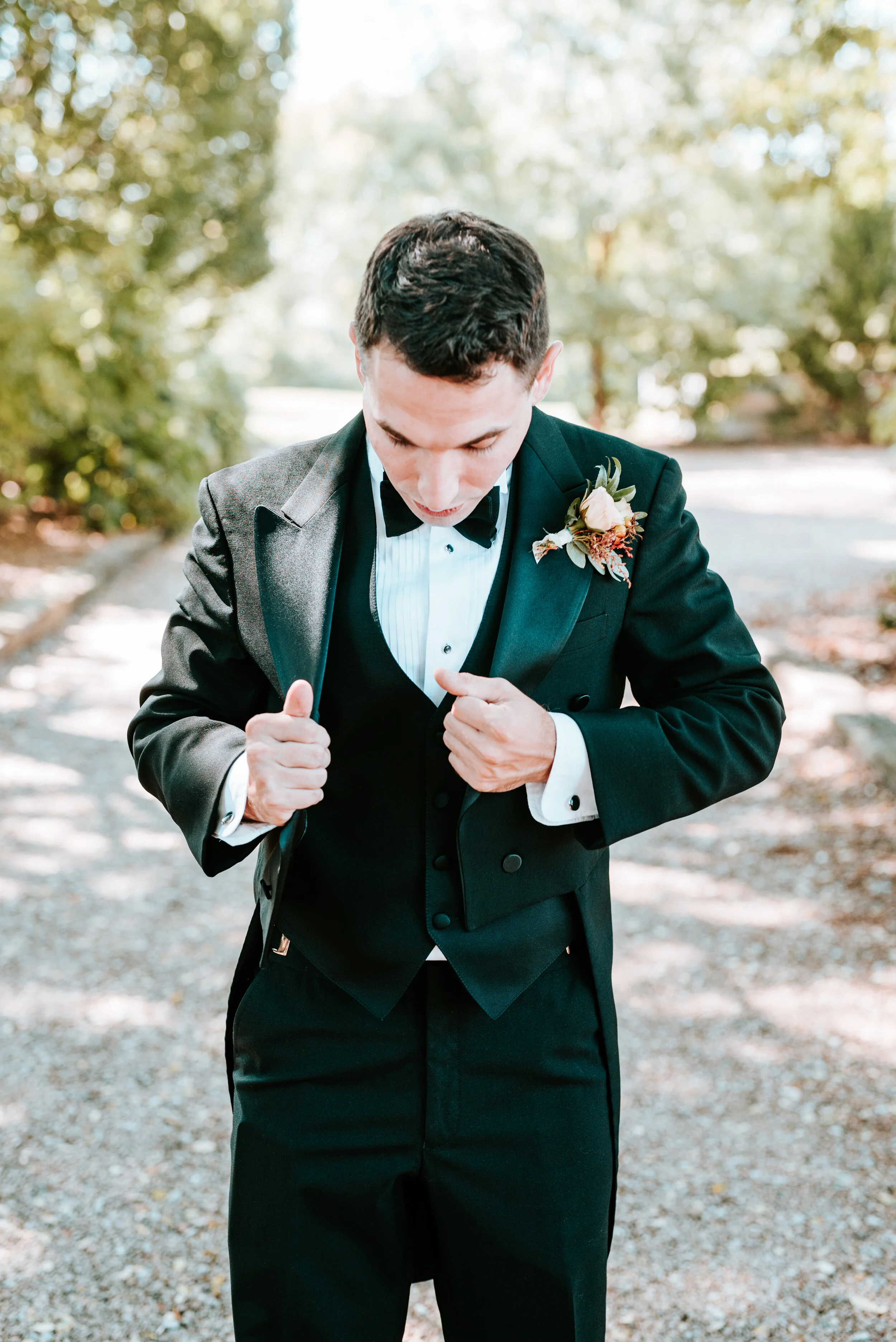 Soft peach spray rose boutonnieres with fall textures, berries, and greenery. Nashville wedding flowers.