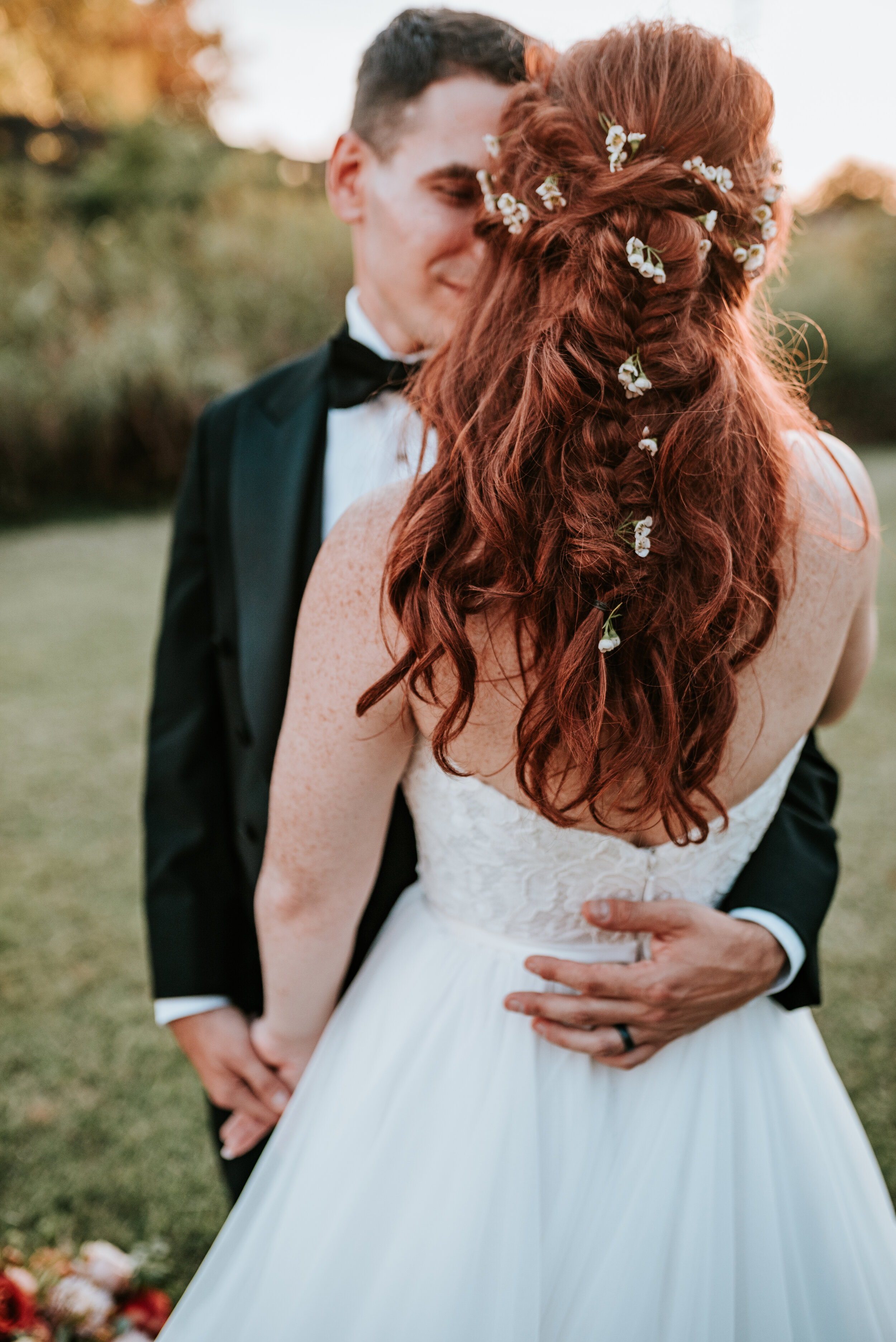 Scattered flowers in the bride's hair. Nashville wedding florist.
