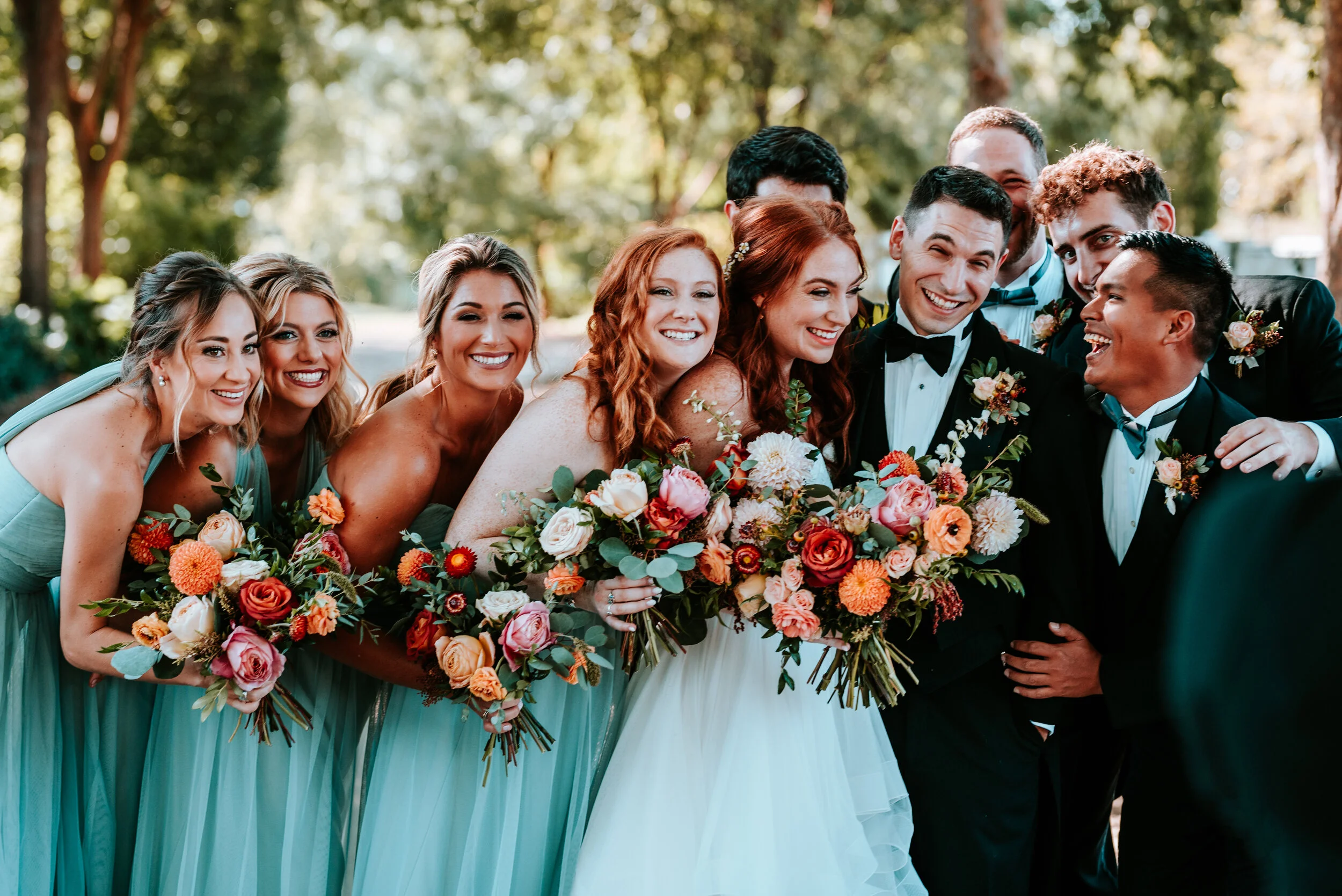 October wedding at Long Hollow Gardens with lush, asymmetrical flower arrangements in a rusty orange and soft peach color palette. Nashville wedding floral design.