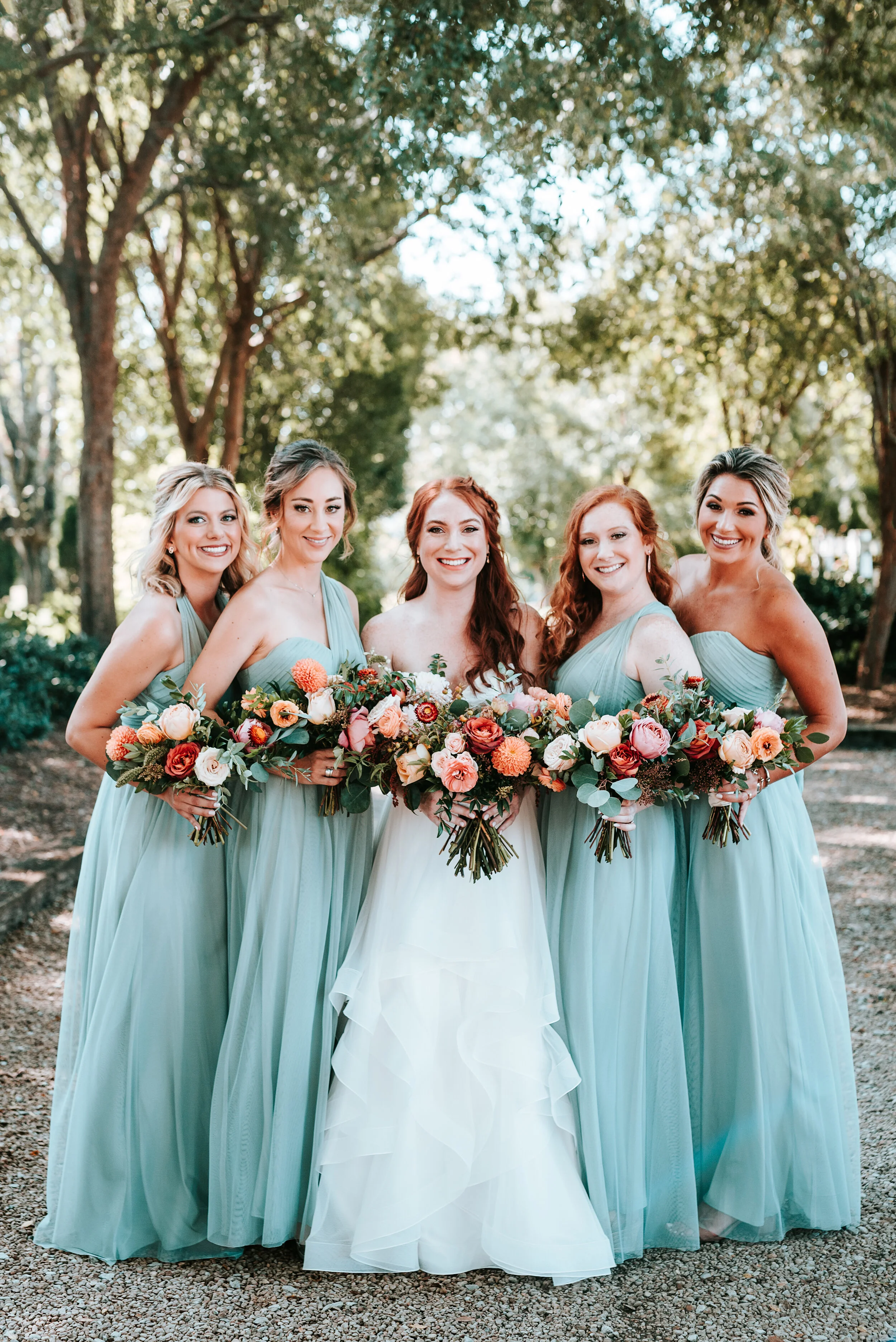 October wedding at Long Hollow Gardens with lush, asymmetrical flower arrangements in a rusty orange and soft peach color palette. Nashville wedding floral design.