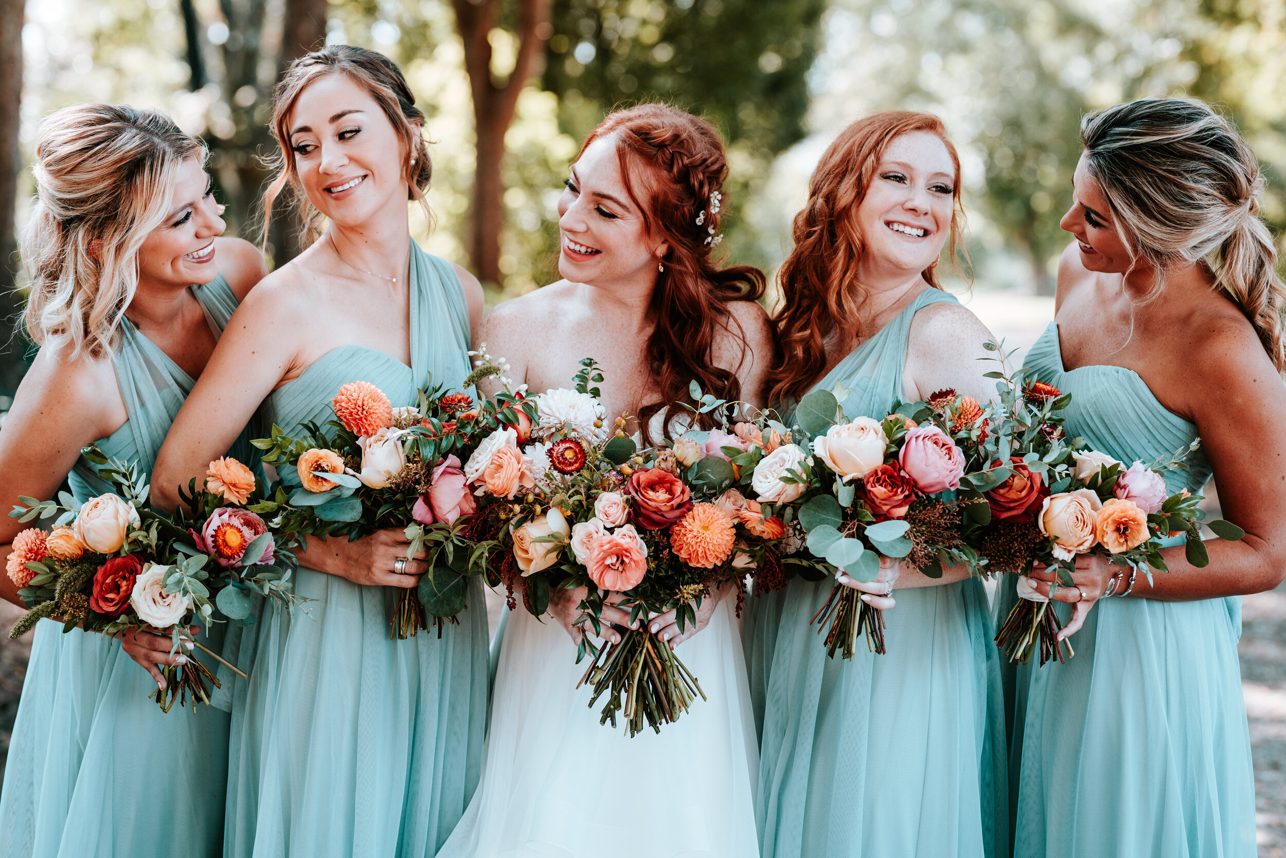 October wedding at Long Hollow Gardens with lush, asymmetrical flower arrangements in a rusty orange and soft peach color palette. Nashville wedding floral design.