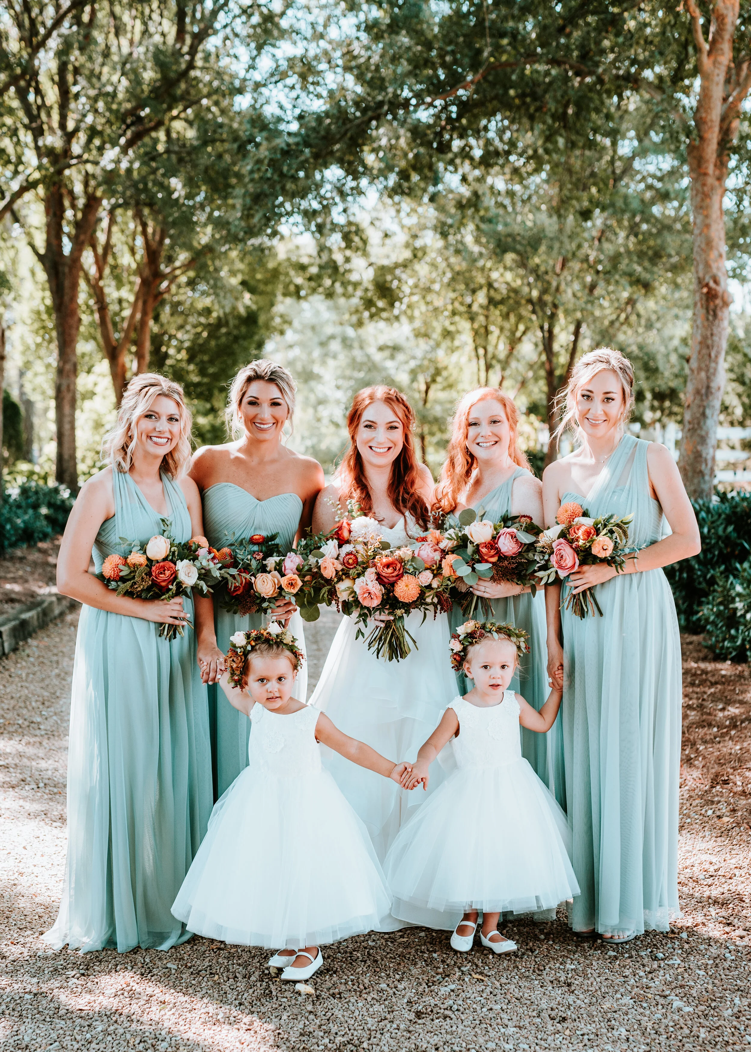 Dainty flower girl crown with burnt orange strawflower, peach spray roses, fall textures, and natural greenery. Nashville Wedding Florist.