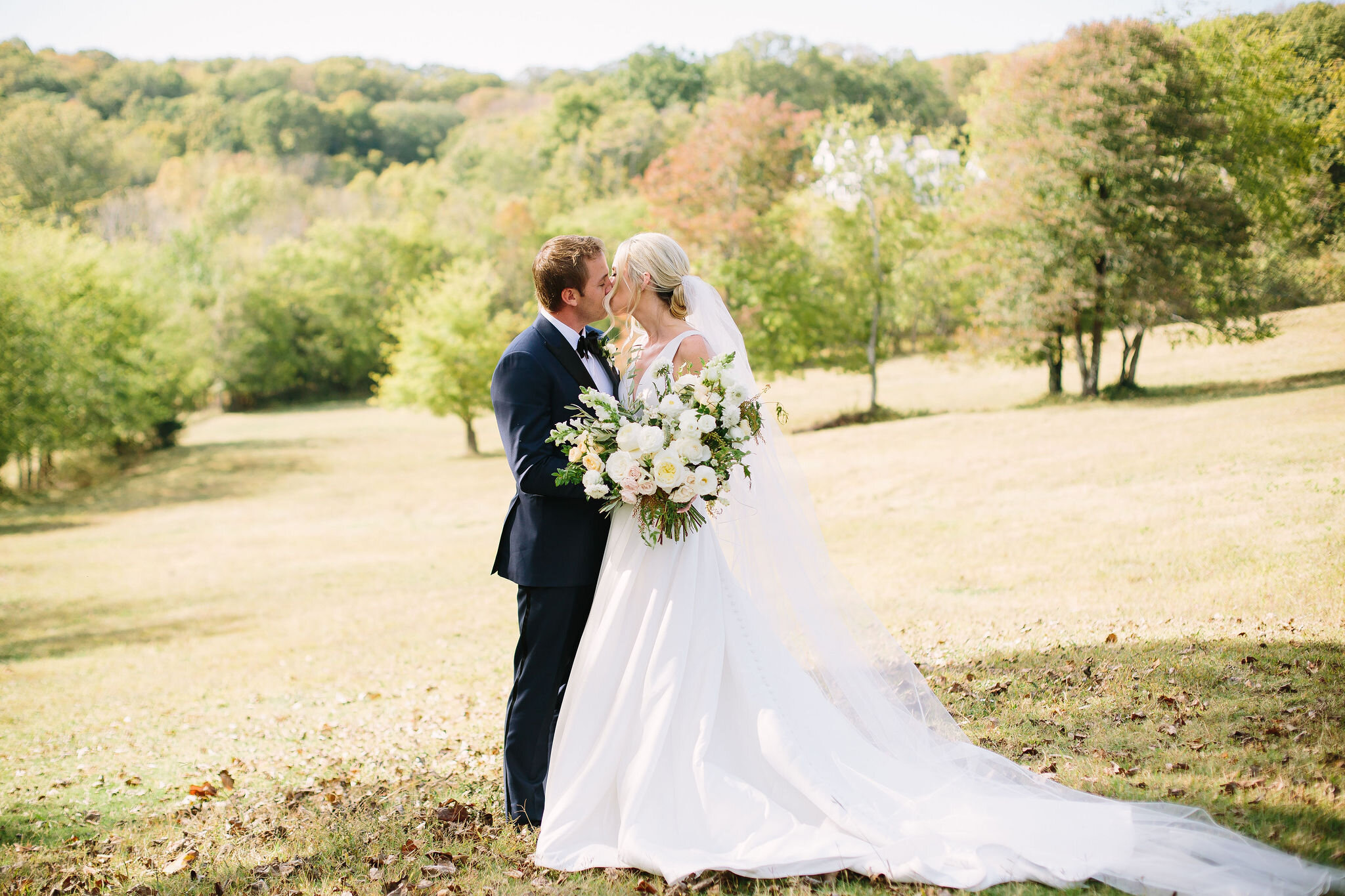 Tennessee countryside October wedding at Bloomsberry Farm with all white and greenery floral design. Nashville wedding florist.