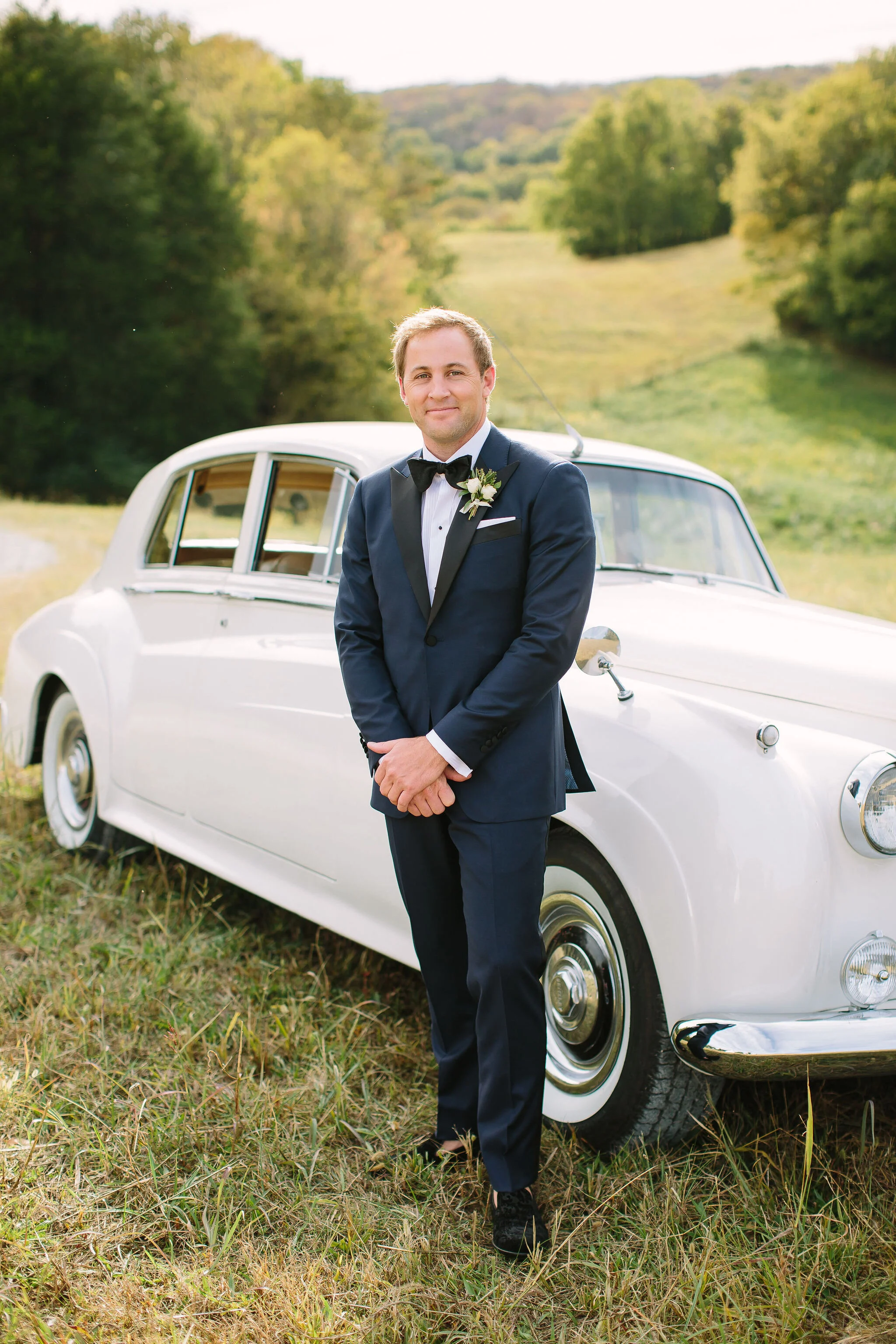 Tennessee countryside October wedding at Bloomsbury Farm with all white and greenery floral design. Nashville wedding florist.