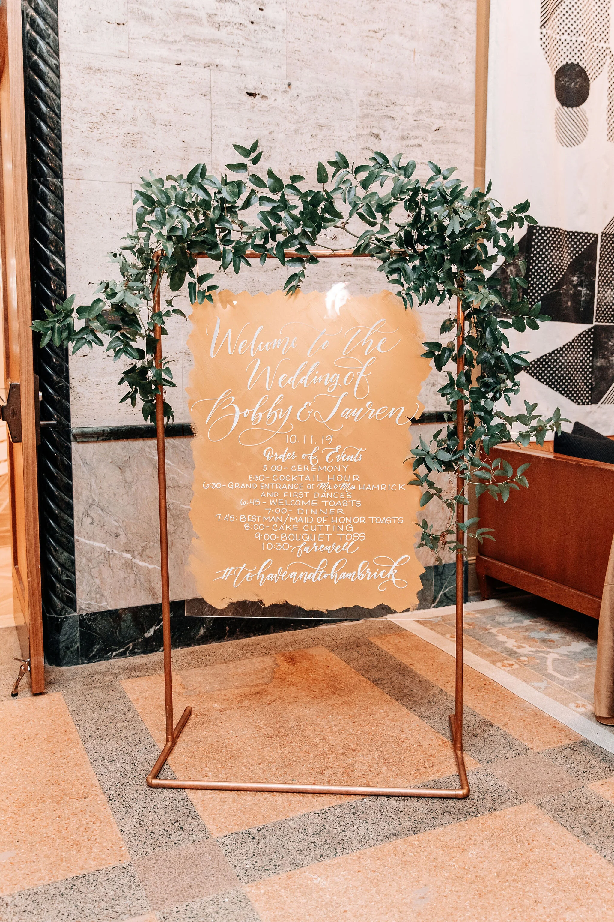 Fall wedding in the ballroom of the Noelle Boutique Hotel in downtown Nashville with lush, garden inspired floral design.