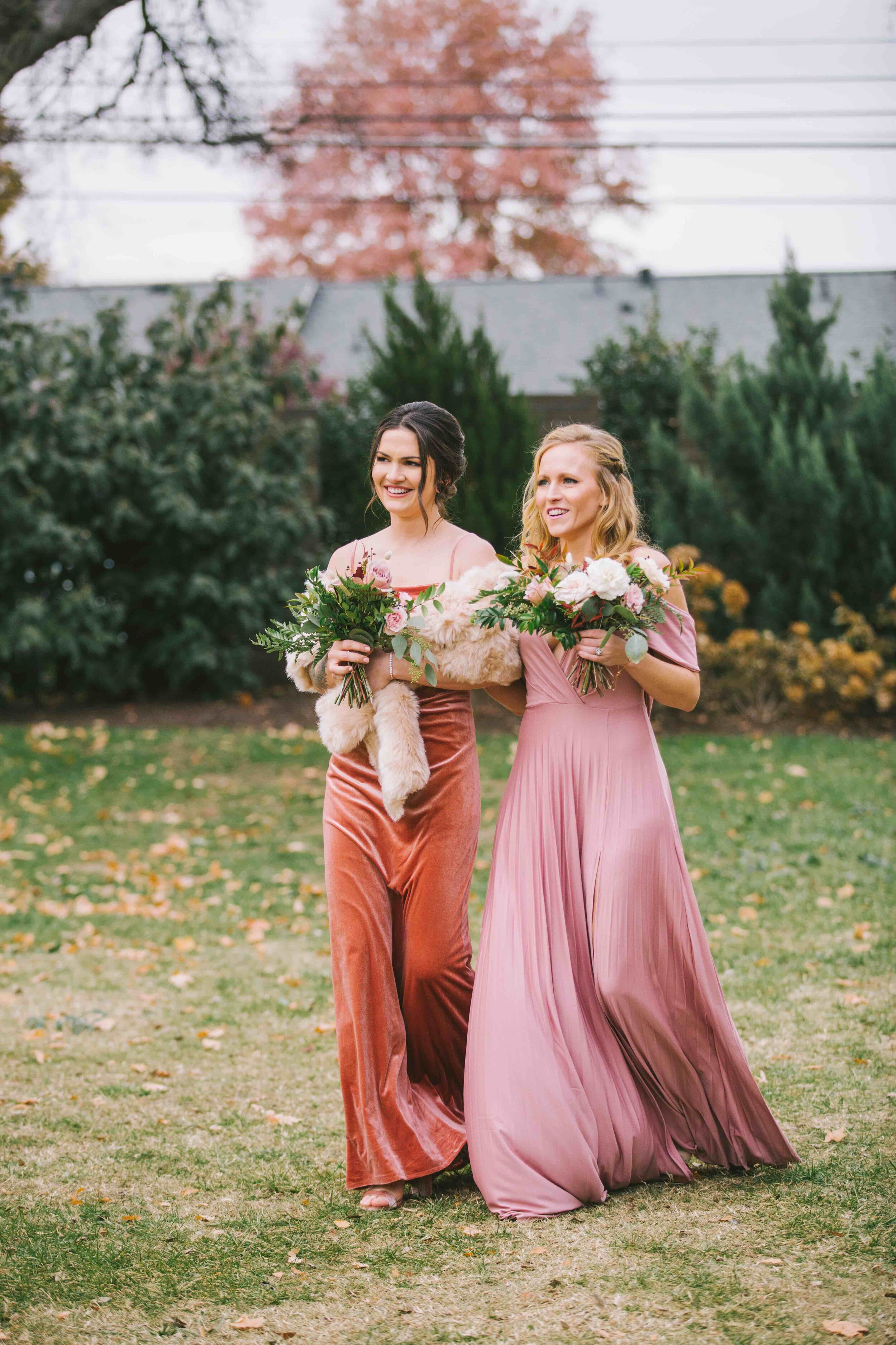 Light mauve and copper bridesmaid dresses with mauve and purple bouquets with lush, untamed greenery. Southeast US wedding floral design.