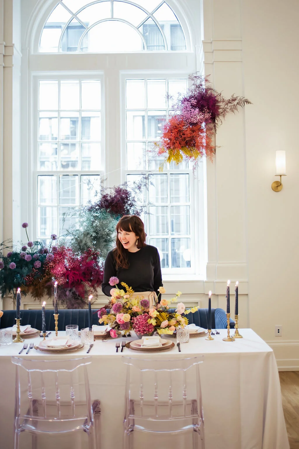 Rainbow colored floral installation with painted and dyed baby’s breath and plums ferns. Modern, minimal, colorful wedding flowers at the Noelle Hotel in downtown Nashville.